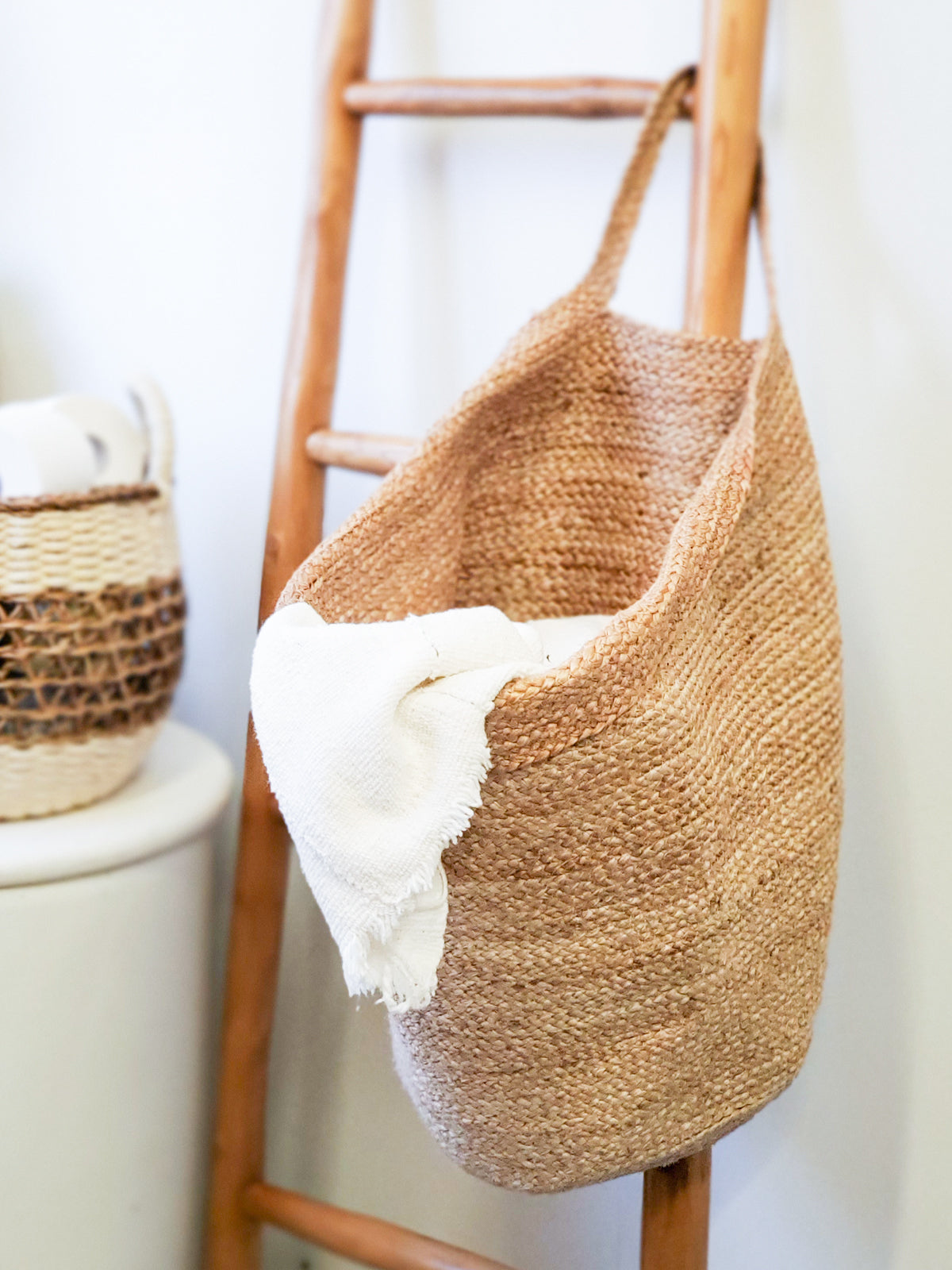 Kata Wall Storage Basket made of handwoven natural jute, showcasing its unique texture and design, perfect for home organization.