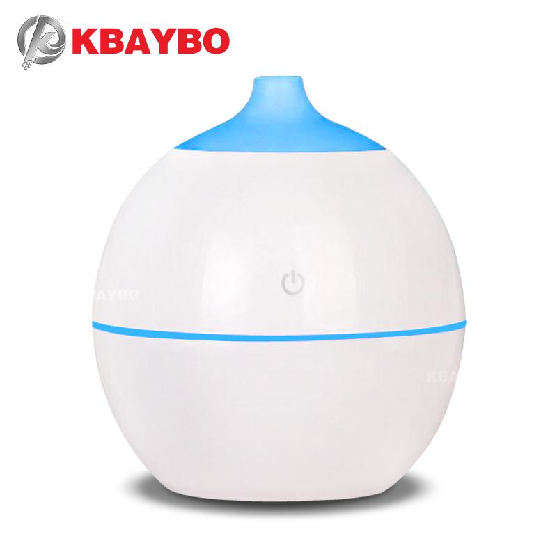 KBAYBO medium diffuser 130ml with wood grain finish, showcasing its sleek design and mist output.