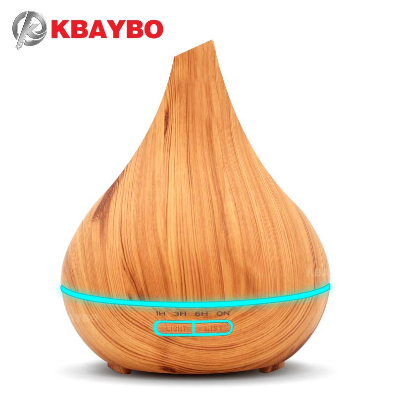 KBAYBO Ultrasonic Air Humidifier in wood design, emitting cool mist with essential oils, perfect for home use.