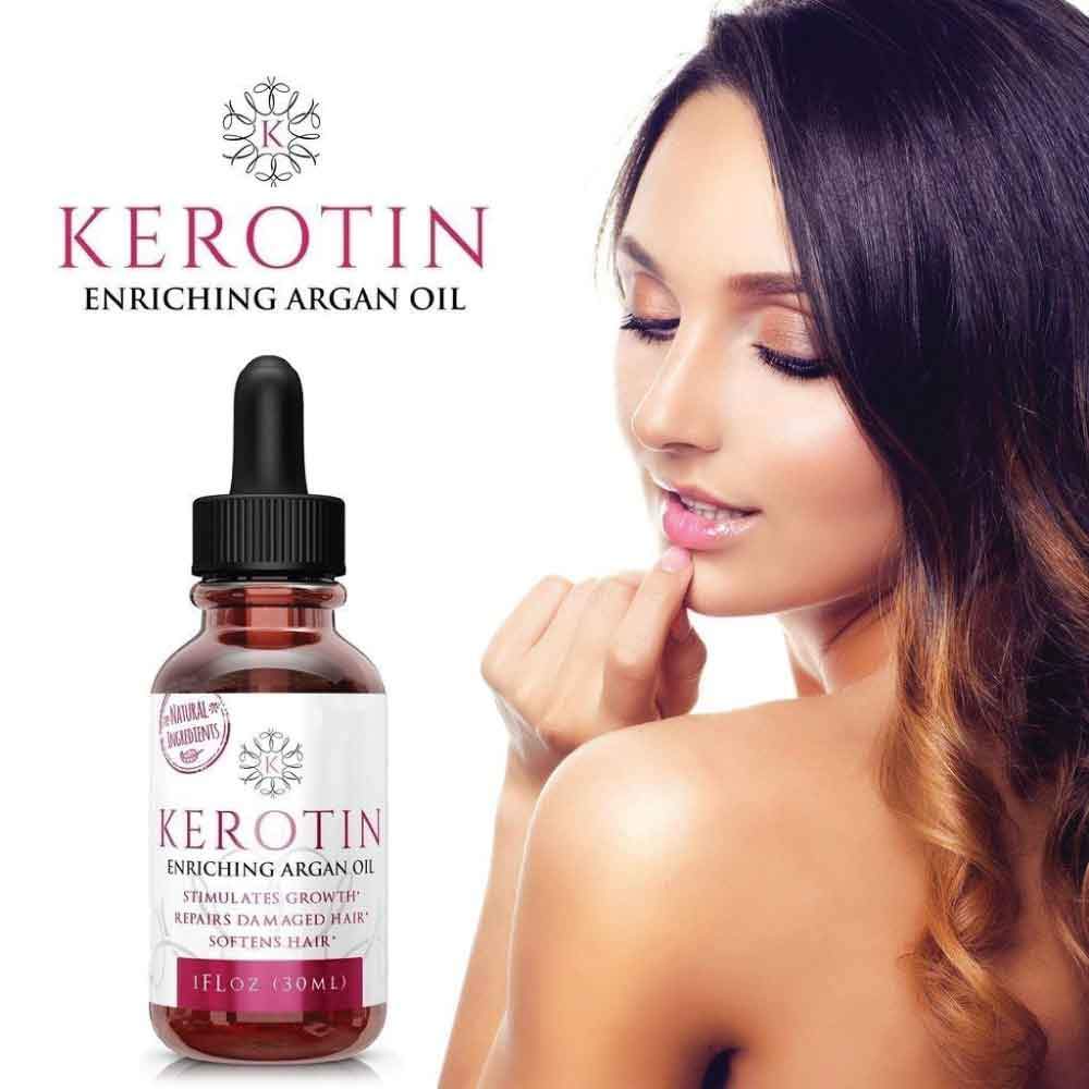 Bottle of Kerotin Enriching Argan Oil with a dropper, showcasing its rich golden color and premium packaging, ideal for hair and skin care.