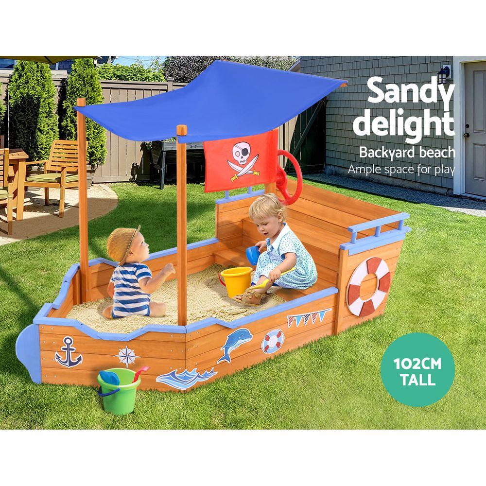 Keezi Boat Sand Pit with Canopy featuring a wooden boat design, steering wheel, and colorful cartoon stickers, perfect for outdoor play.