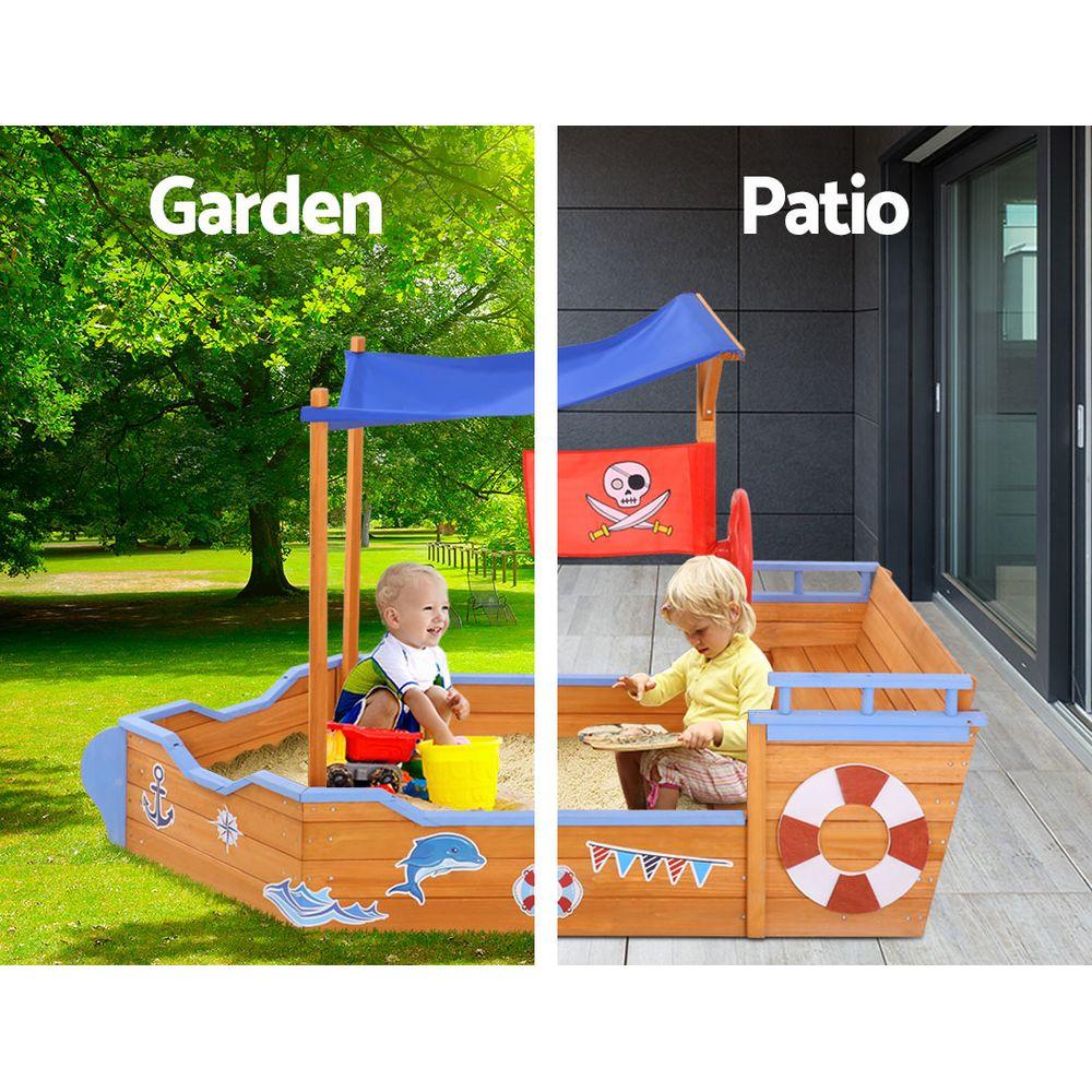 Keezi Boat Sand Pit with Canopy featuring a wooden boat design, steering wheel, and colorful cartoon stickers, perfect for outdoor play.