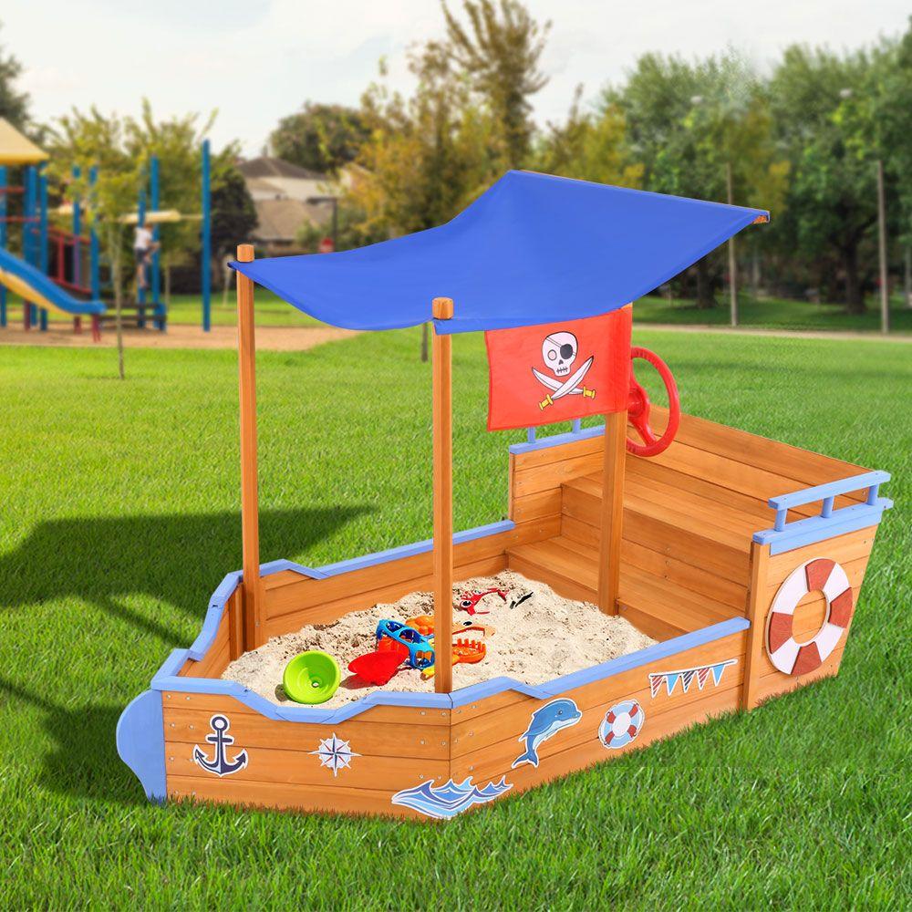 Keezi Boat Sand Pit with Canopy featuring a wooden boat design, steering wheel, and colorful cartoon stickers, perfect for outdoor play.