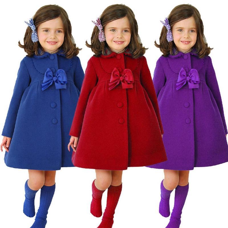 A stylish kids designer coat for girls featuring a big bow, made of 100% cotton, perfect for winter and spring seasons.