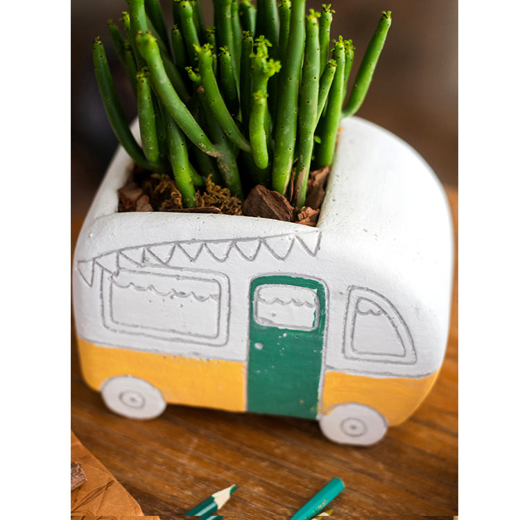 Kids Desktop Bus Planter in vibrant colors, featuring a cute bus design made of cement, perfect for small plants.