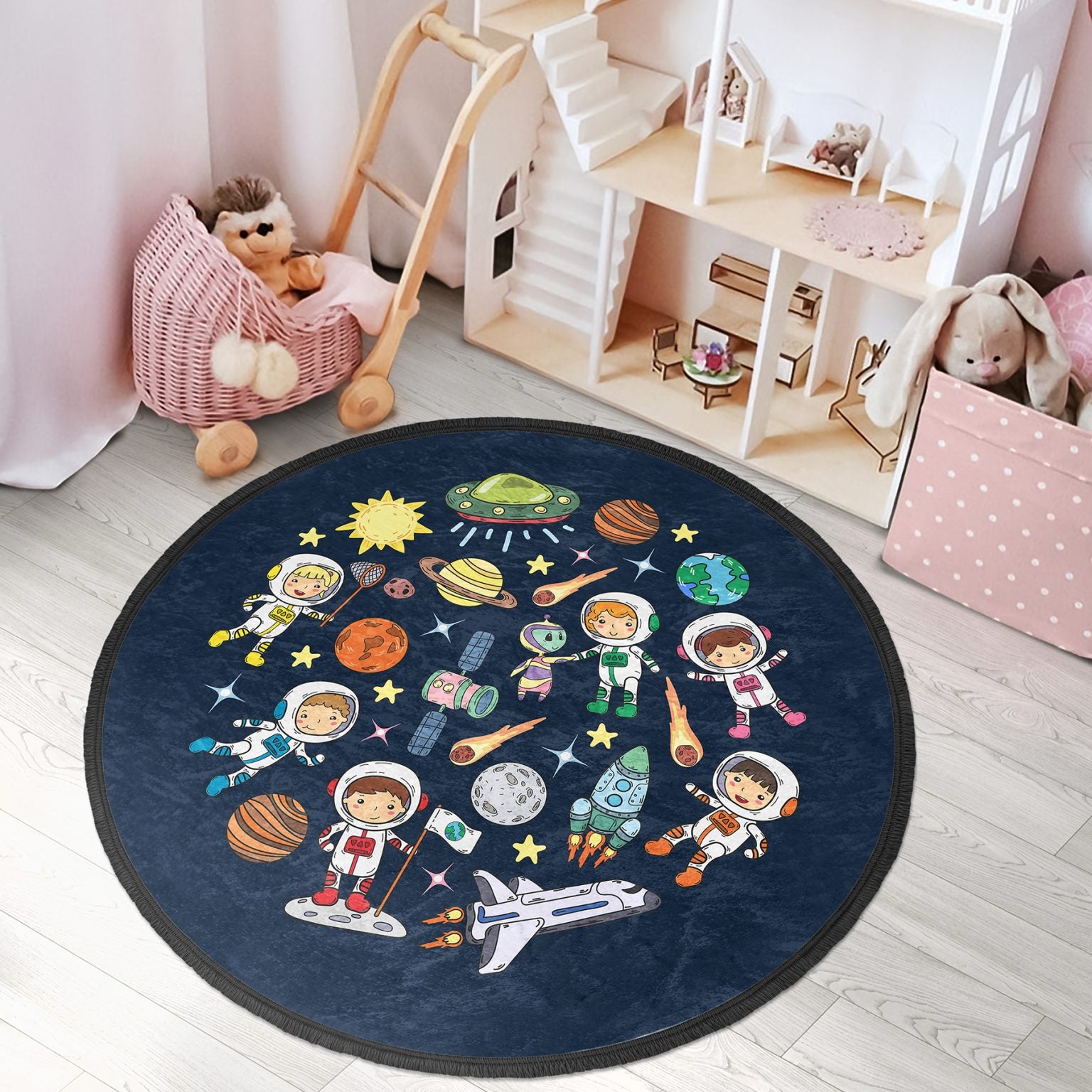 Round kids room area rug with a cute space design, featuring vibrant colors and fringed edges, perfect for nurseries and playrooms.