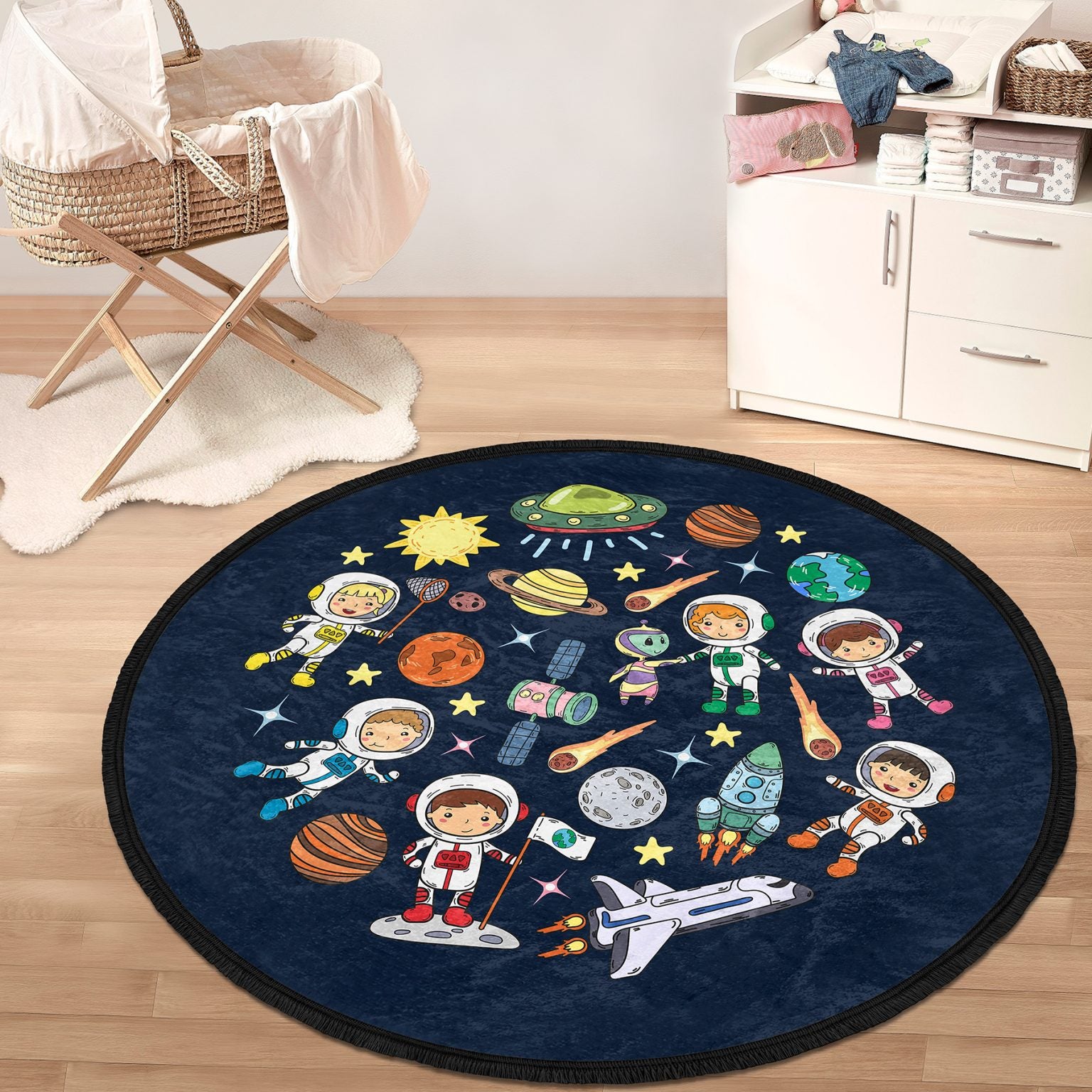 Round kids room area rug with a cute space design, featuring vibrant colors and fringed edges, perfect for nurseries and playrooms.