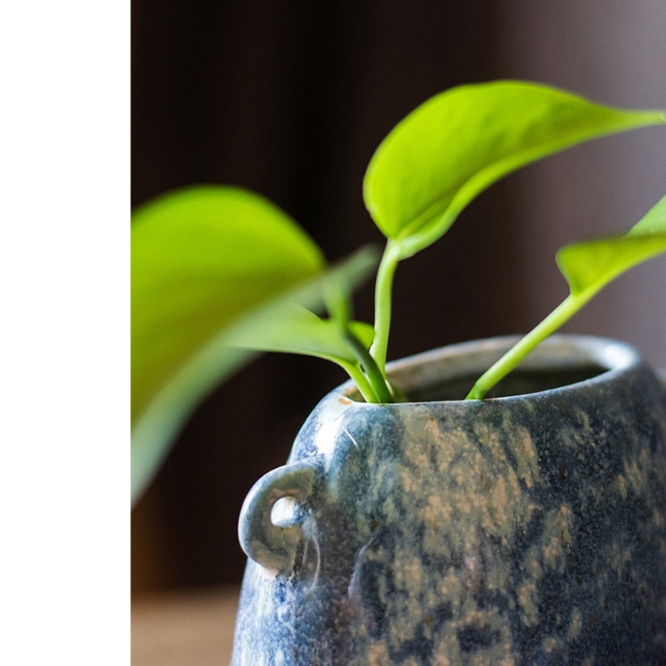 A beautifully handcrafted Kiln Glazed Blue Vase featuring a mix of blue, white, and tan colors, showcasing unique shapes and a glossy finish.