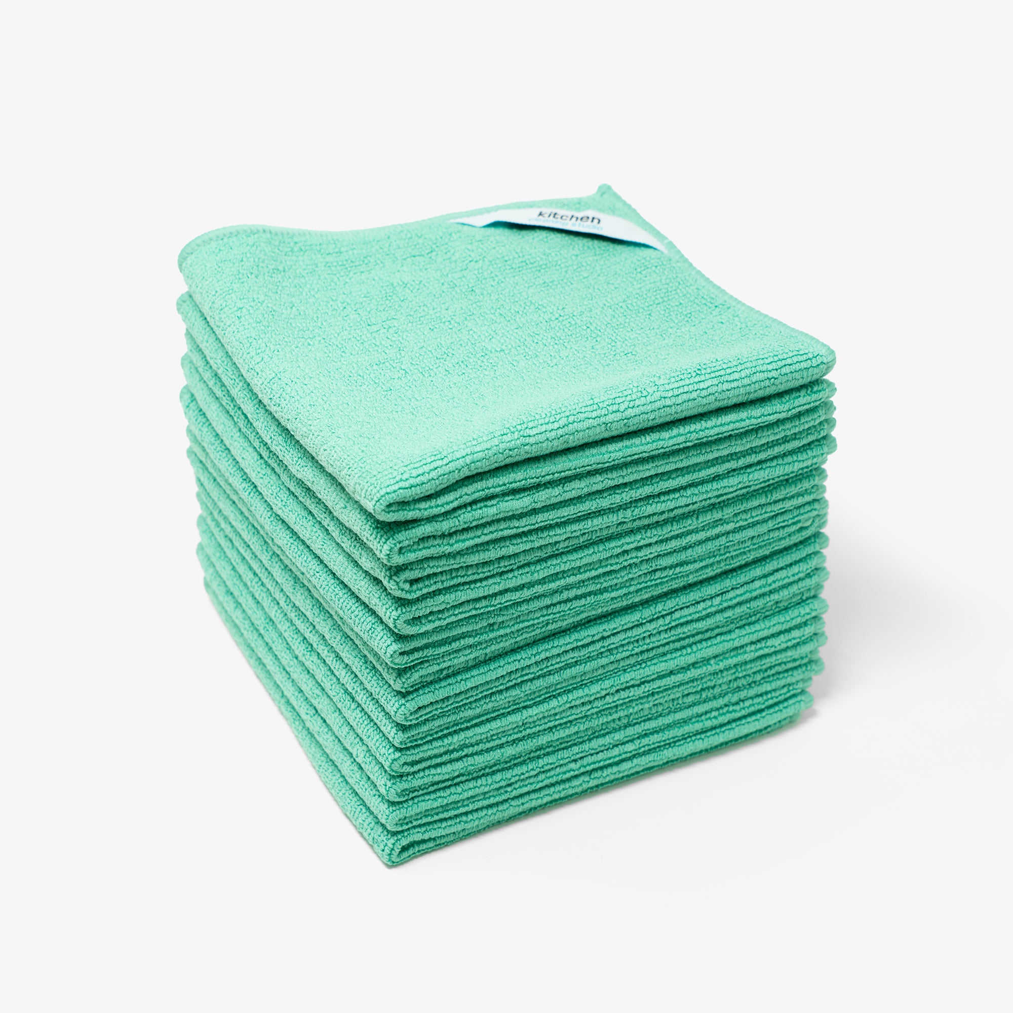 Premium Kitchen Microfiber Cleaning Cloth in mint green, showcasing its soft texture and corner tag for easy drying.