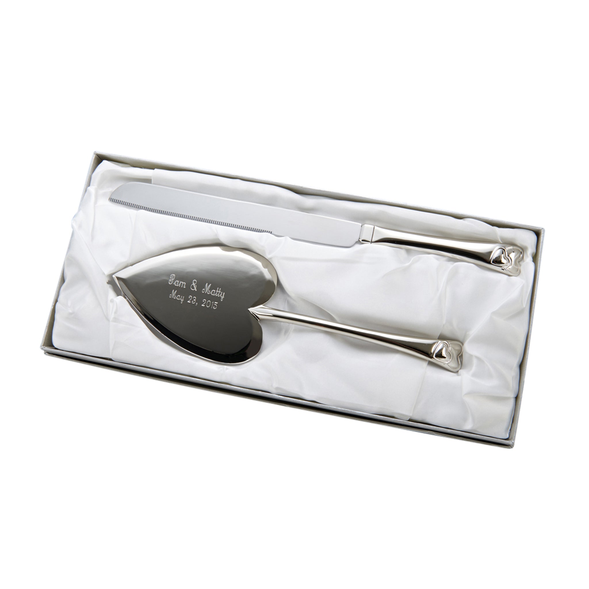 Knife and server set featuring entwined heart handles and a heart-shaped cake server, elegantly gift boxed.