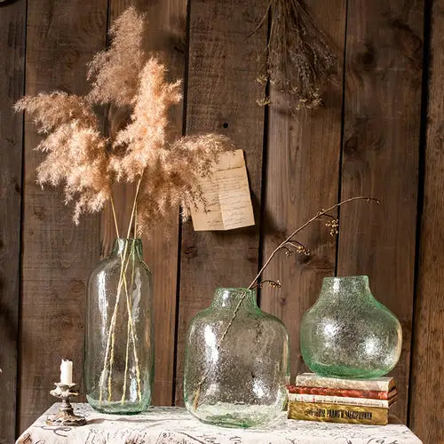 Large Artisan Glass Irregular Shape Vase in clear and green colors, showcasing its unique hand-blown design and elegant curves.