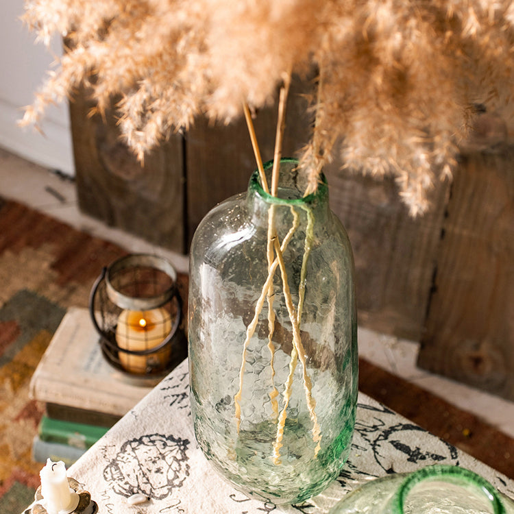 Large Artisan Glass Irregular Shape Vase in clear and green colors, showcasing its unique hand-blown design and elegant curves.