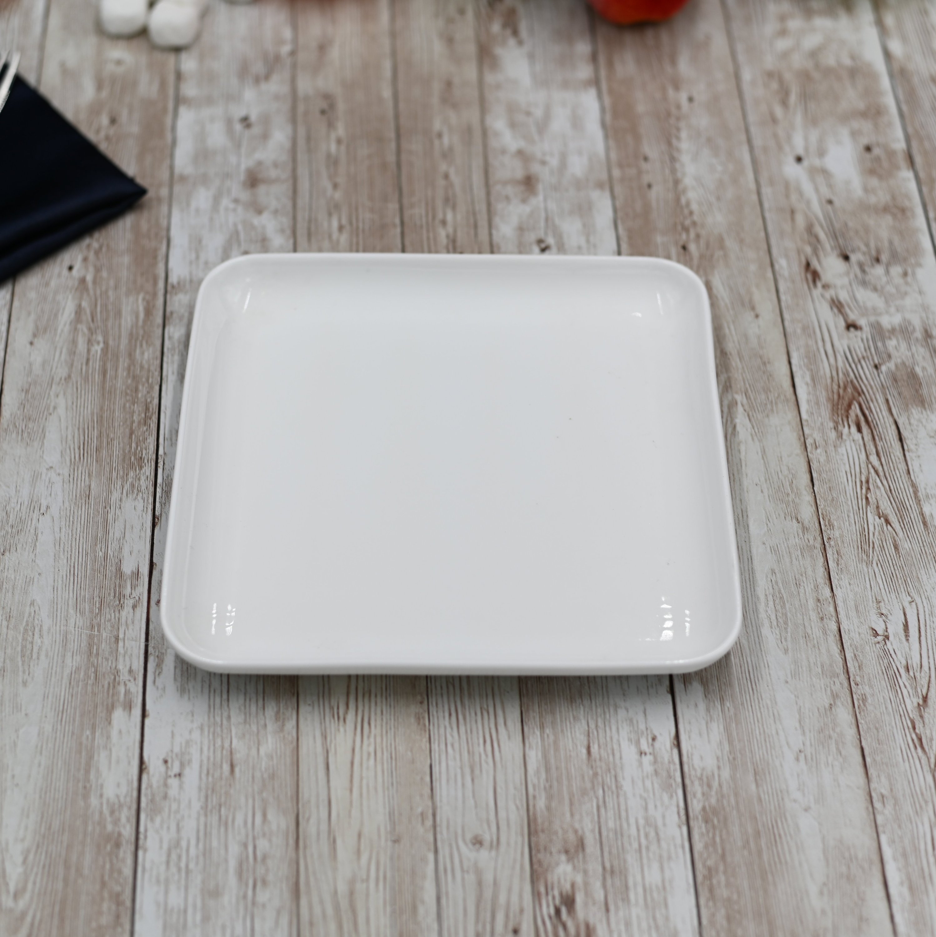 Large Feast Charcuterie Plating Set featuring a long bamboo serving tray and assorted porcelain plates and bamboo platters, ideal for entertaining.