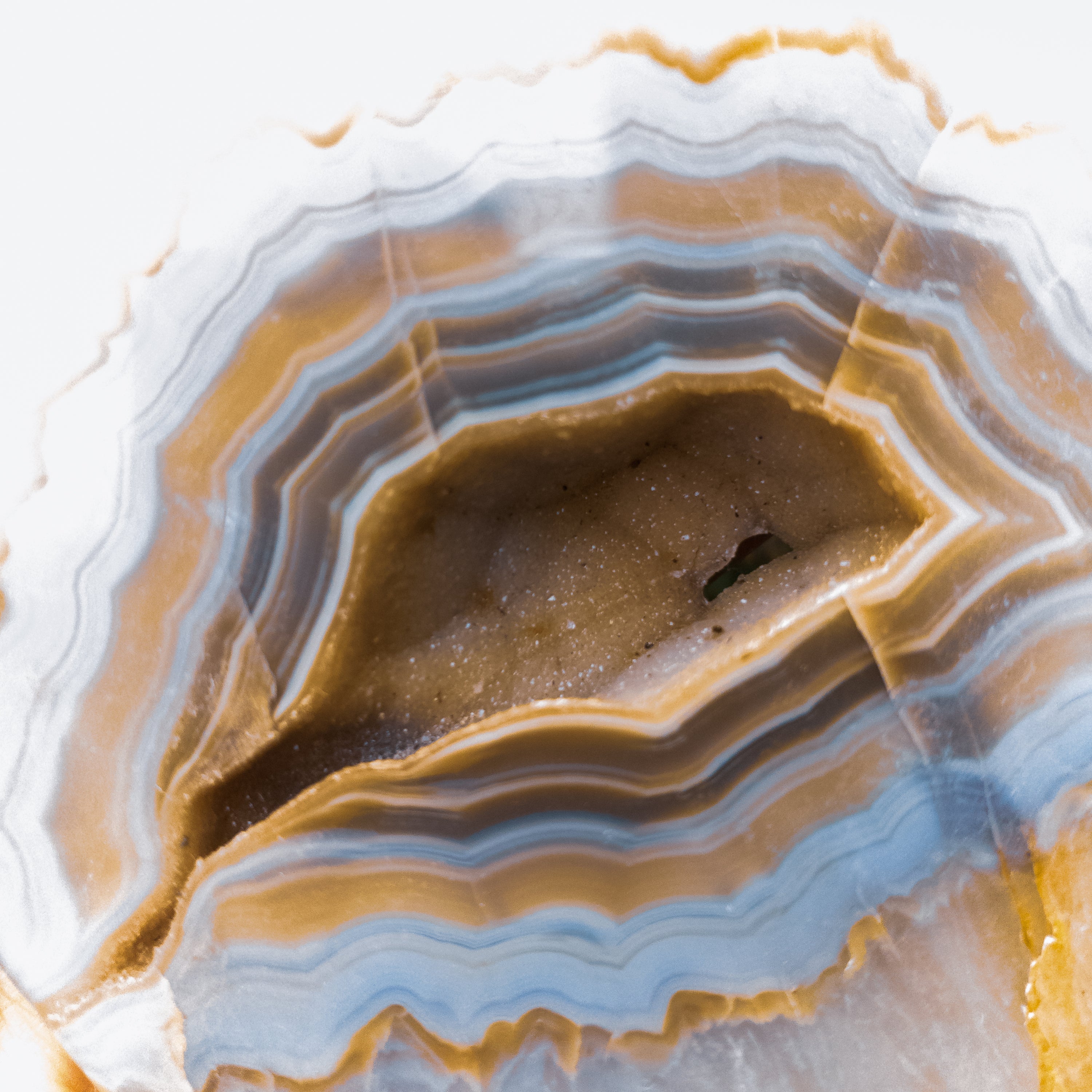 A large heart-shaped agate stone, showcasing vibrant colors and unique patterns, handcrafted by Brazilian artisans.