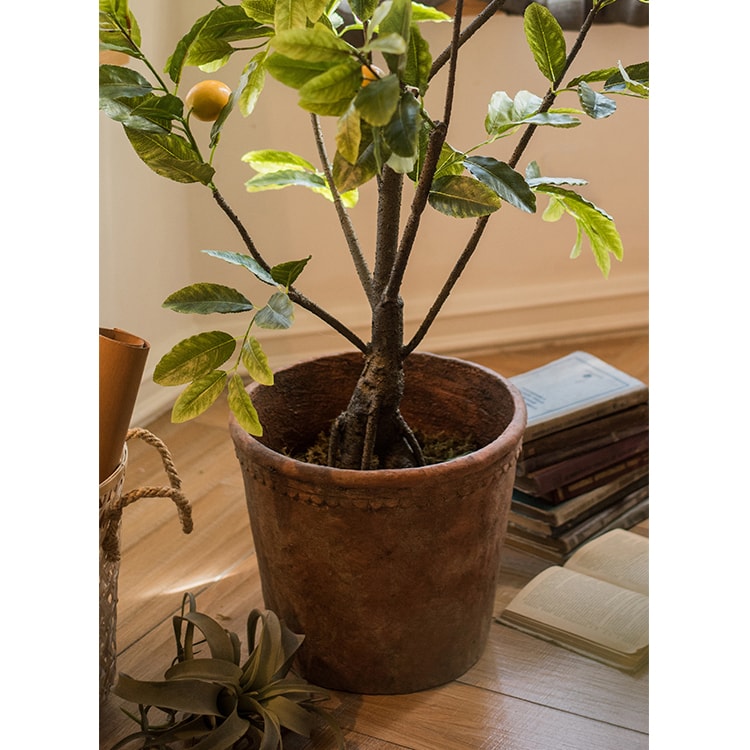 Large terracotta red concrete planter pot with drainage hole, ideal for outdoor gardening.