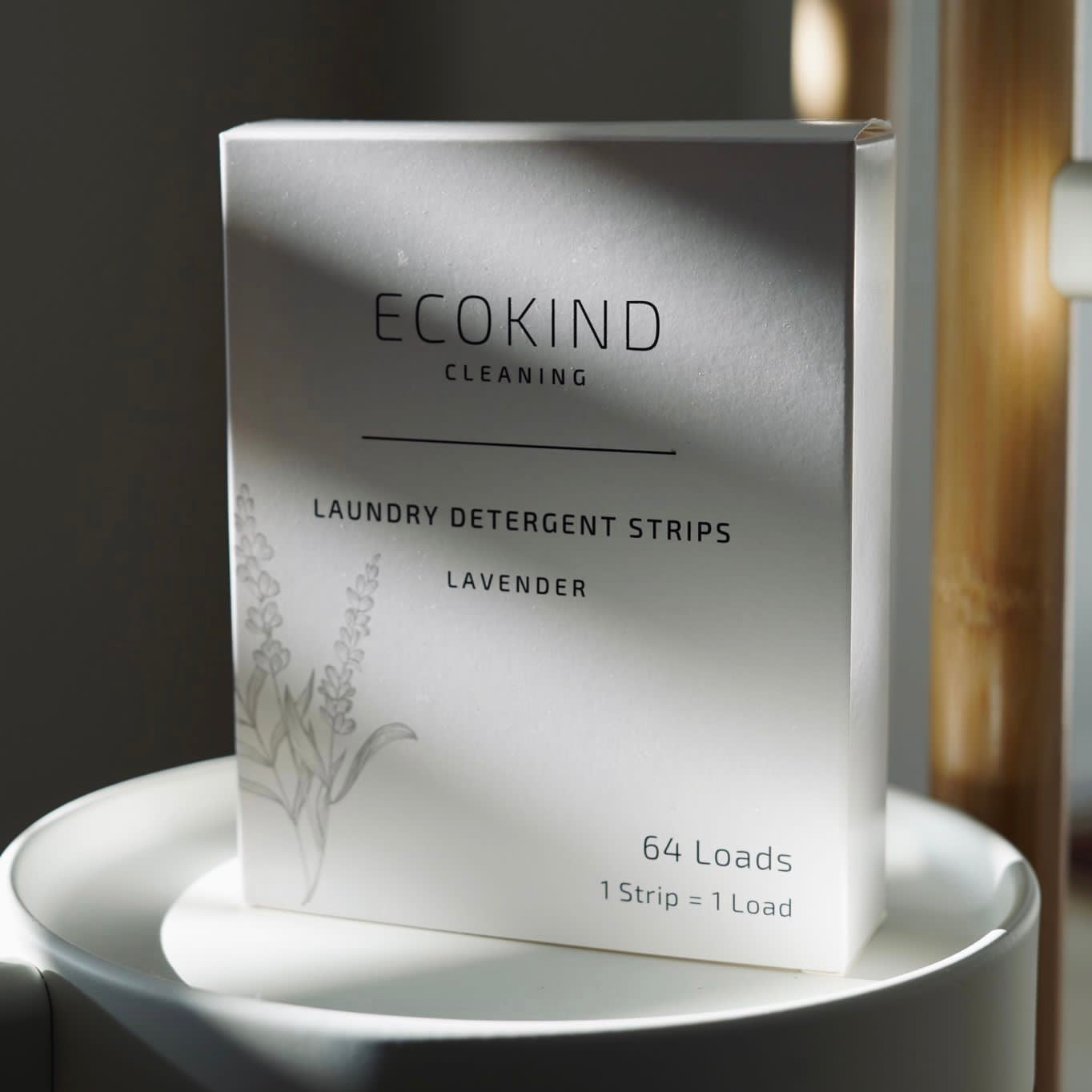 A pack of ECOKIND eco-friendly laundry detergent strips, showcasing their convenient and sustainable design.