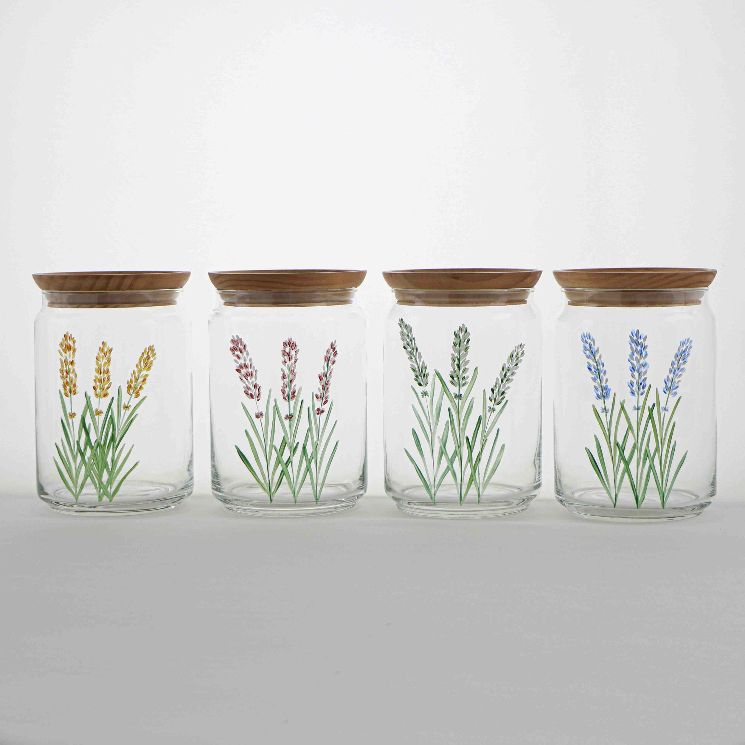 A beautifully hand-painted 1L glass jar with an airtight seal, ideal for storing dry foods like flour and rice.