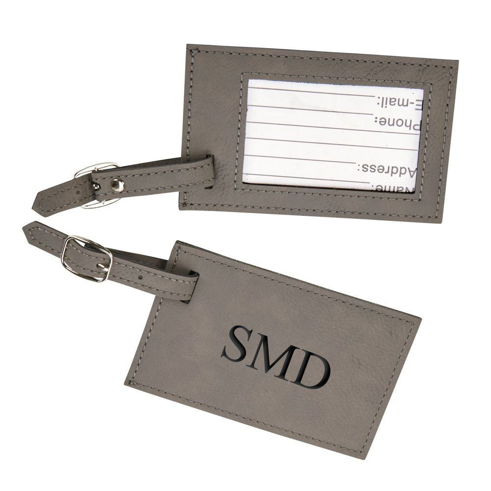 Grey leatherette luggage tag with clear window and buckled strap, measuring 2.75" x 4.375".