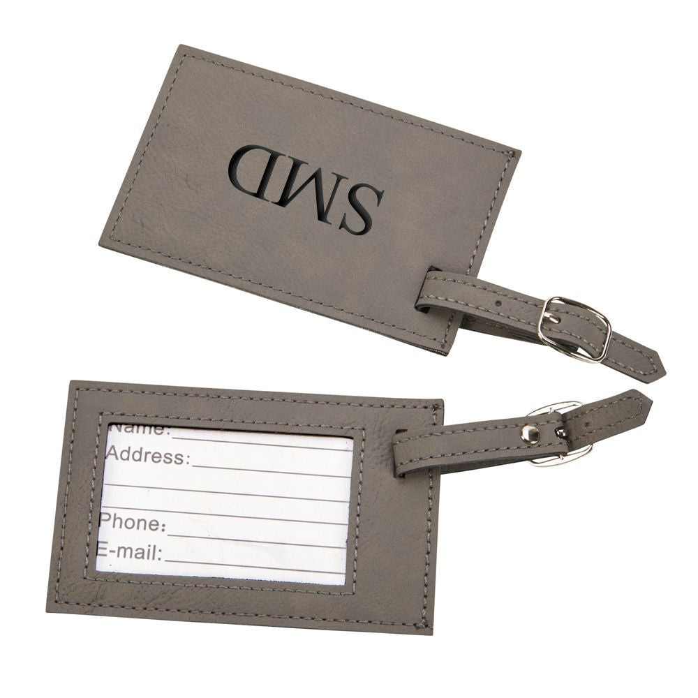 Grey leatherette luggage tag with clear window and buckled strap, measuring 2.75" x 4.375".