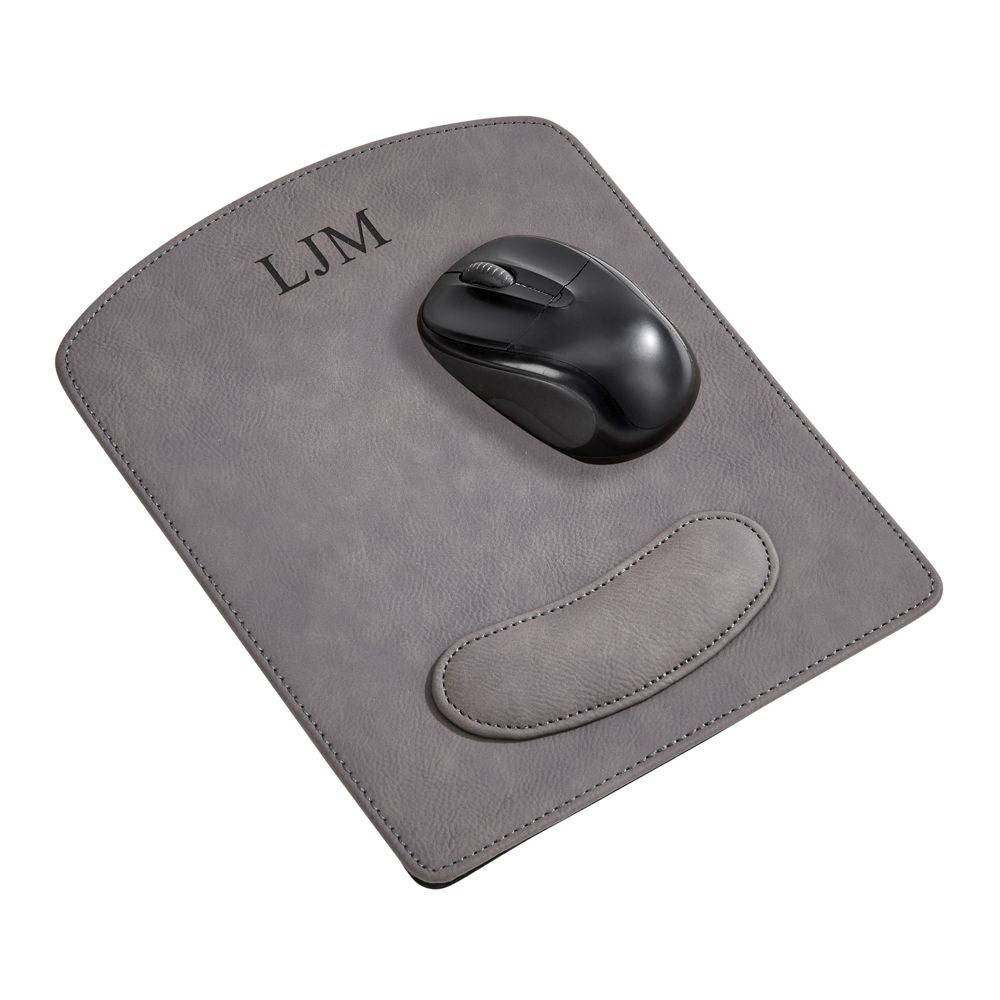 Grey leatherette mouse pad measuring 9.75" x 8" with wrist support and laser engraving option, elegantly gift boxed.