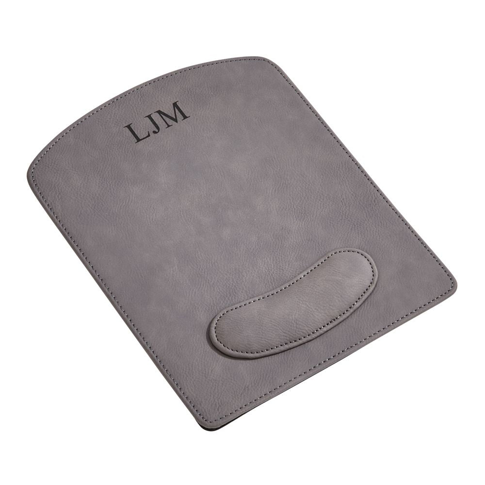 Grey leatherette mouse pad measuring 9.75" x 8" with wrist support and laser engraving option, elegantly gift boxed.