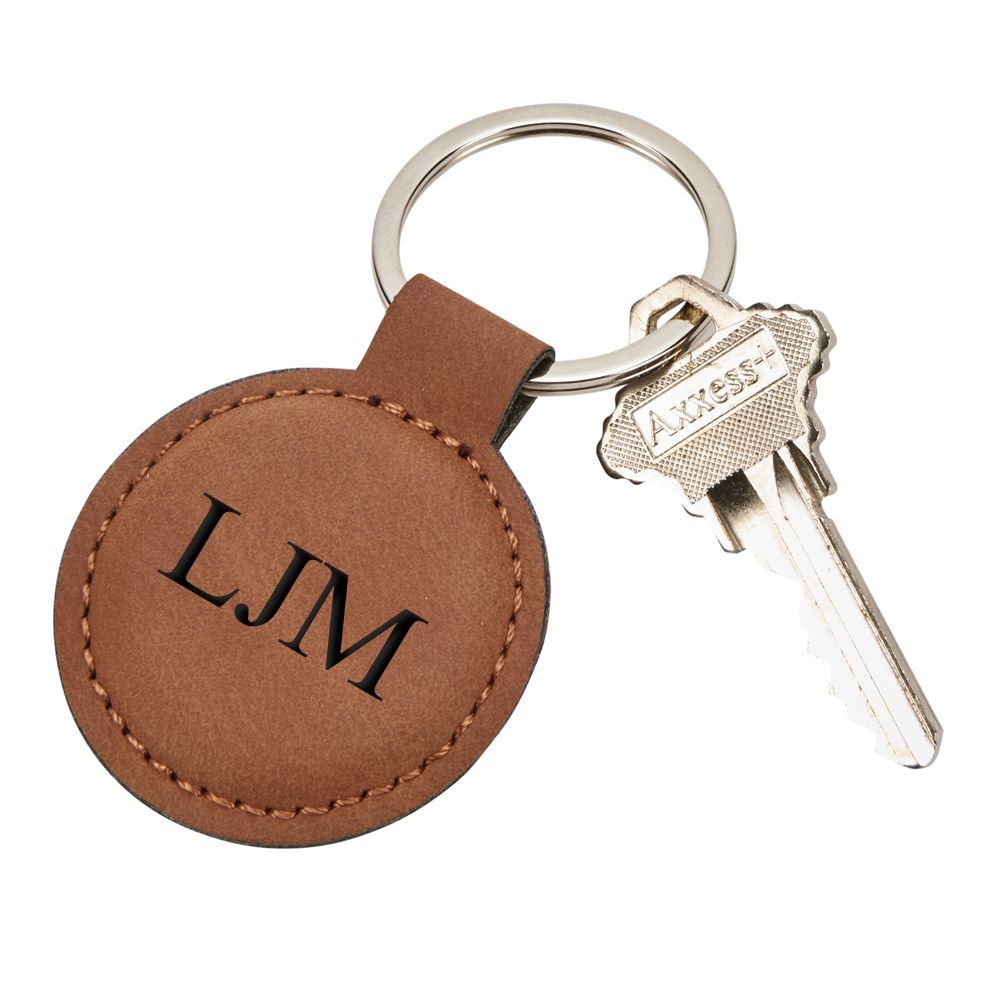 Caramel leatherette round keychain with stitching, 1.875 inches in diameter, includes a 1.25-inch key ring.