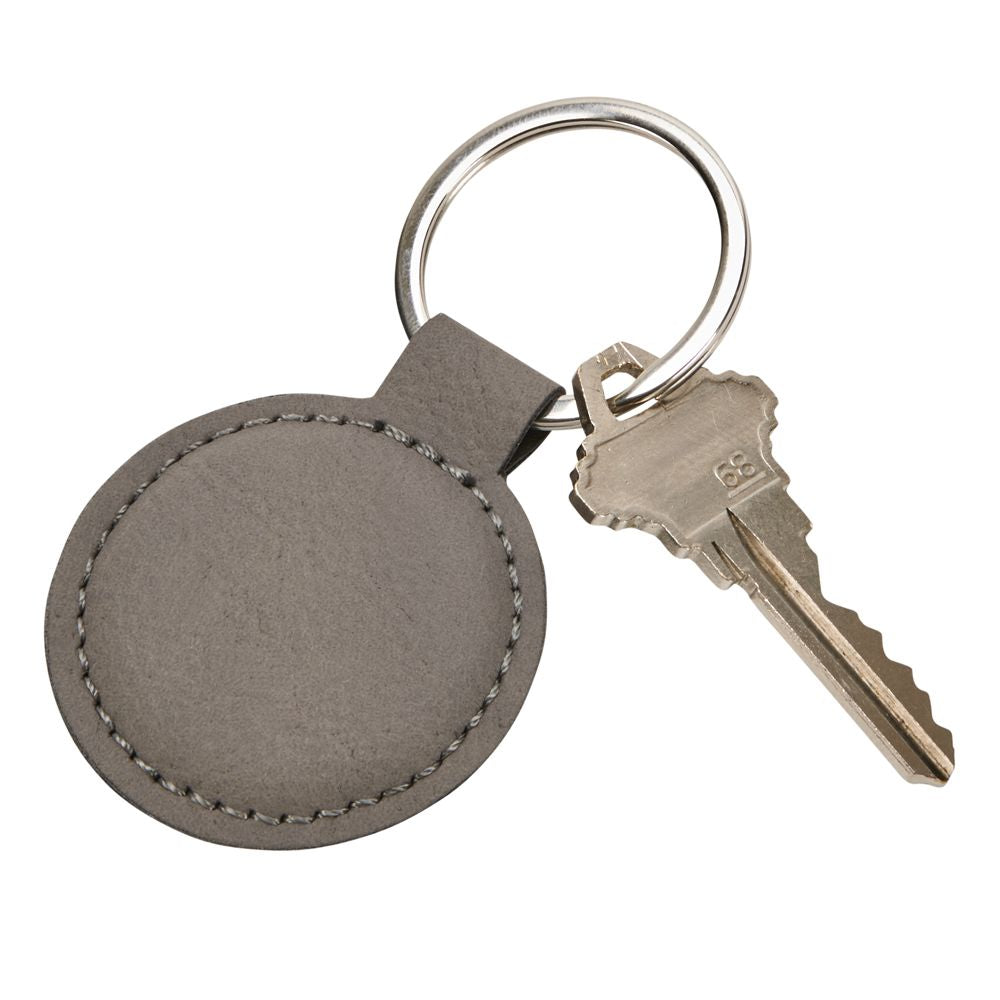 Grey leatherette round keychain with stitching, 1.875 inches in diameter, featuring a smooth surface for engraving.