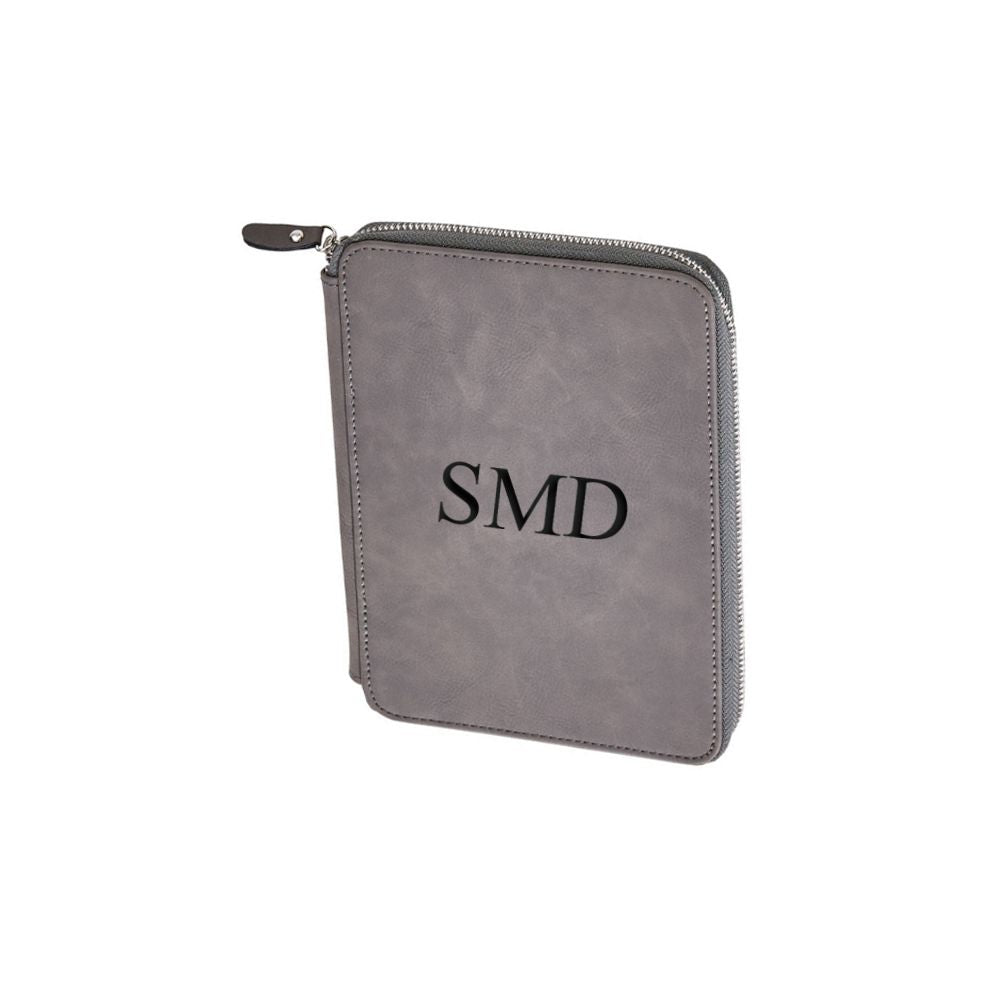 Grey leatherette zippered case with lined paper and card slots, elegantly designed for organization.