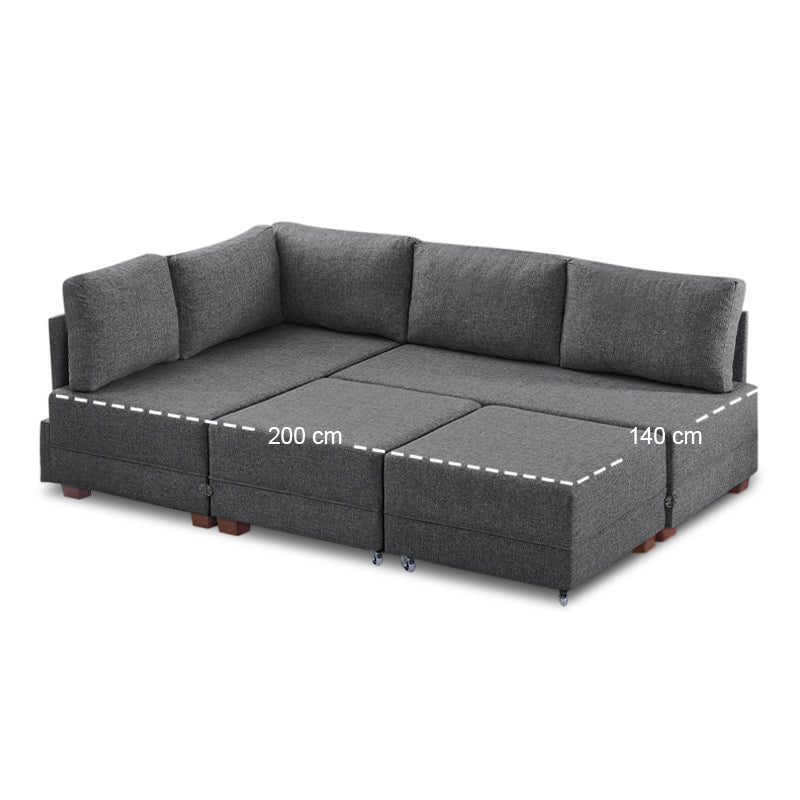 ANDRE Left Corner Sofa/Bed in Charcoal, featuring a modern design with removable trays and stools.