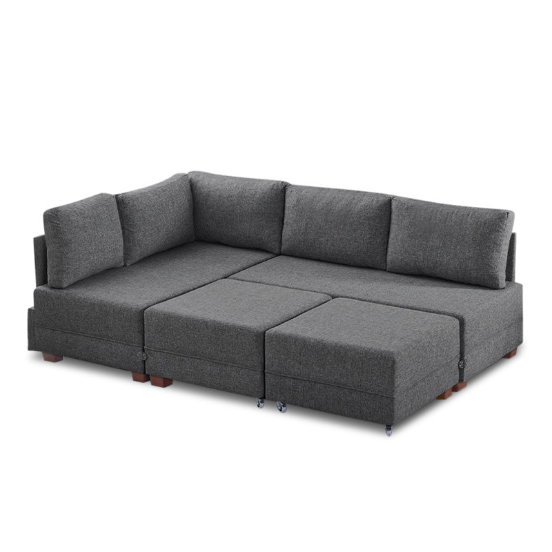 ANDRE Left Corner Sofa/Bed in Charcoal, featuring a modern design with removable trays and stools.