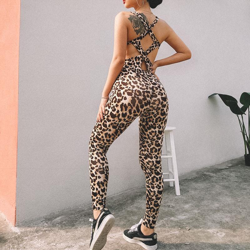 A stylish leopard print gym jumpsuit designed for fitness, featuring long pants and a trendy design.