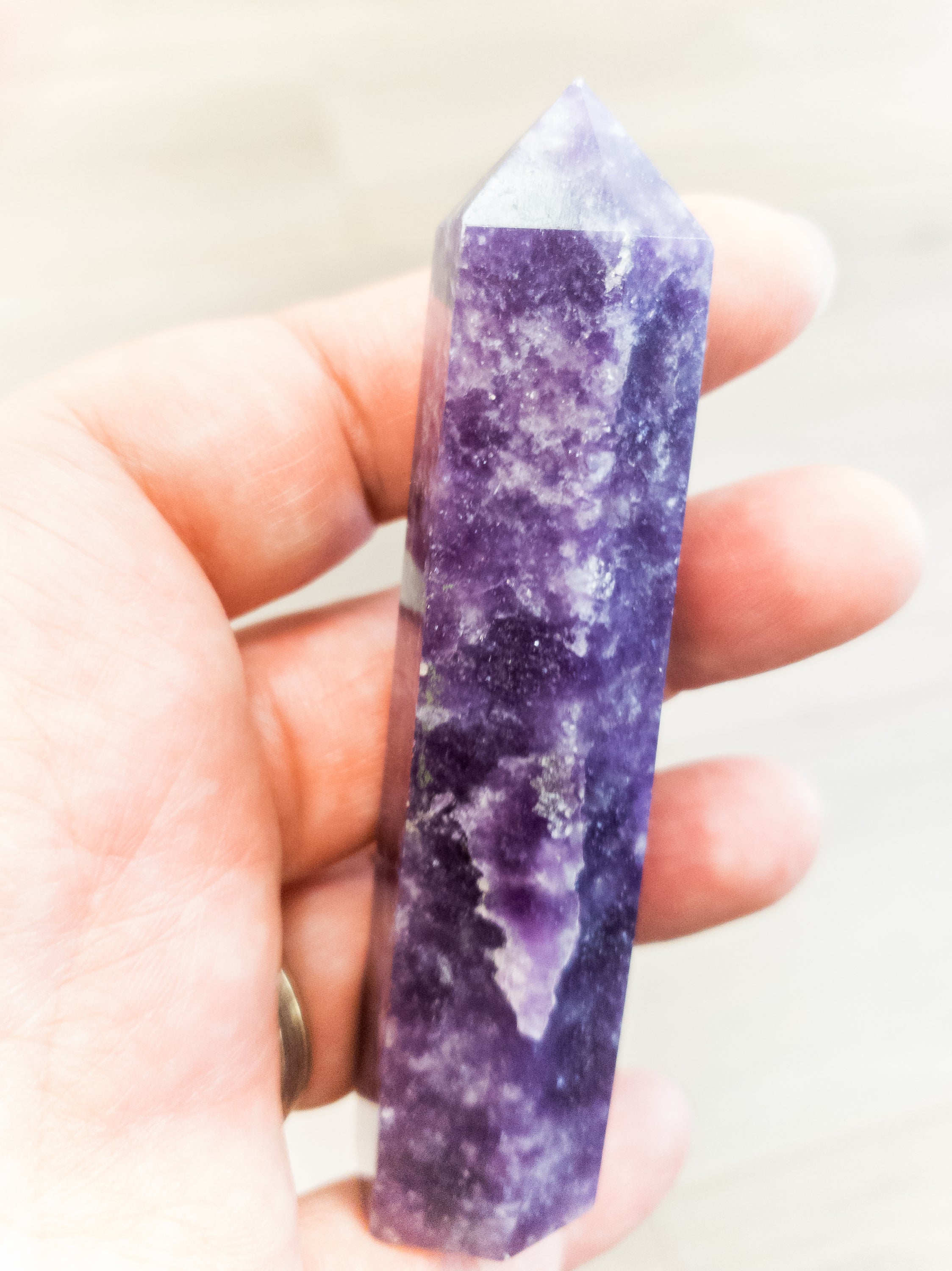 A pair of beautiful purple Lepidolite polished points, showcasing their unique texture and color, ideal for home decor and relaxation.