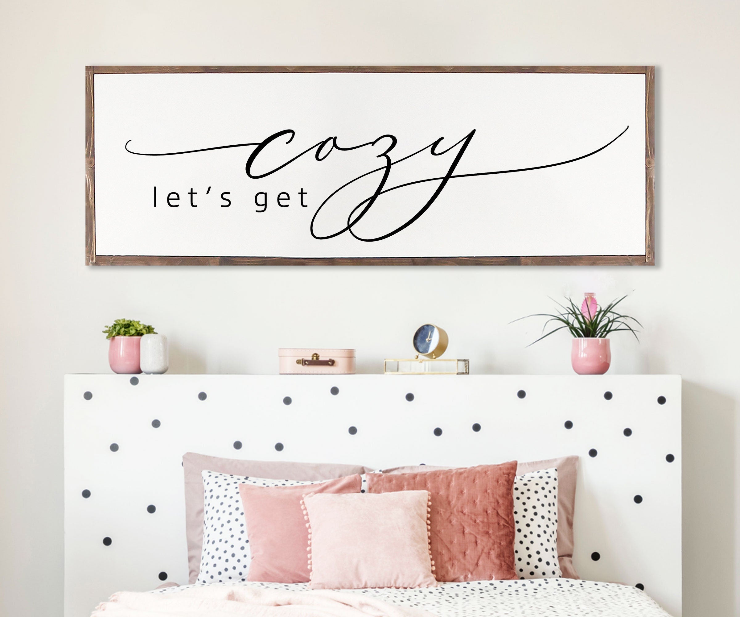 Rustic handmade wood sign featuring the phrase 'Let's Get Cozy', framed and stained in customizable colors, showcasing unique wood grain.