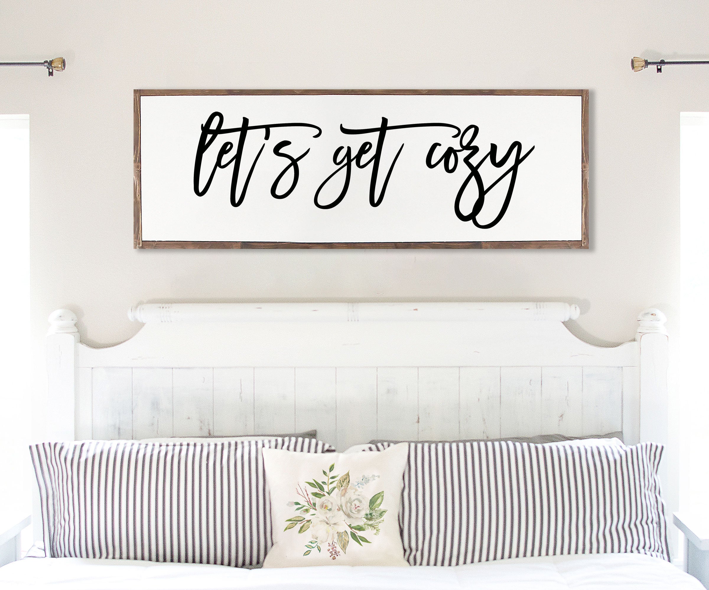 Rustic handmade wood sign with the phrase 'Let's Get Cozy', featuring unique wood grain and customizable frame options.