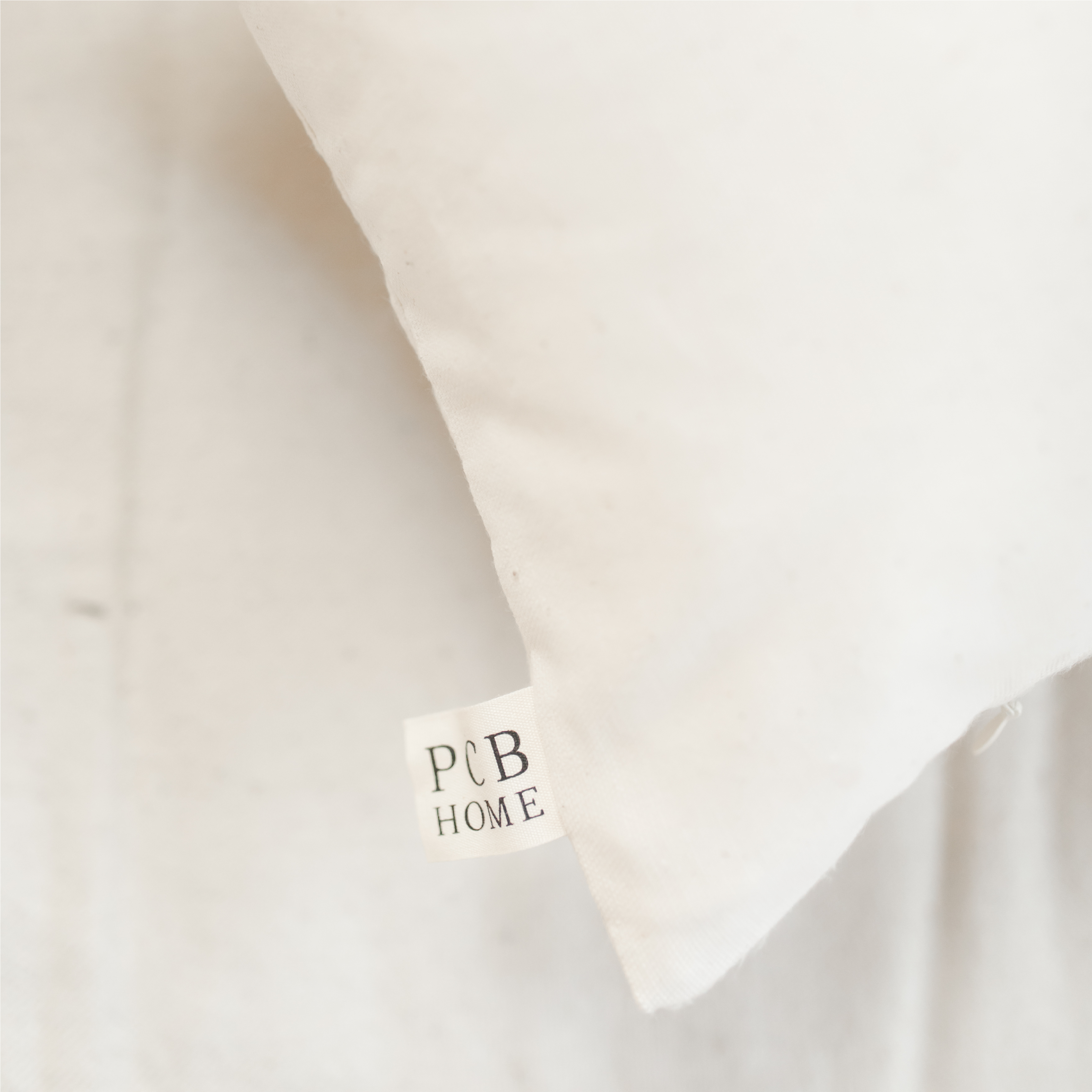 Let's Stay Home Lumbar Pillow featuring elegant calligraphy on a neutral background, perfect for farmhouse-style decor.