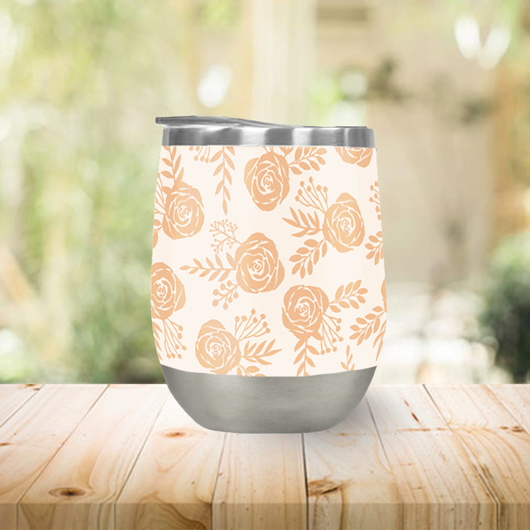 Light orange floral wine tumbler with double-wall insulation, perfect for outdoor use.