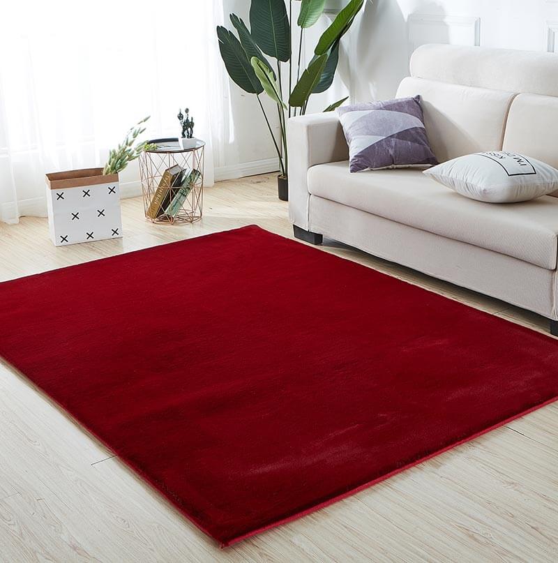 Lily Luxury Red Chinchilla Faux Fur Area Rug showcasing a plush, vibrant red surface with a soft texture, perfect for contemporary living spaces.