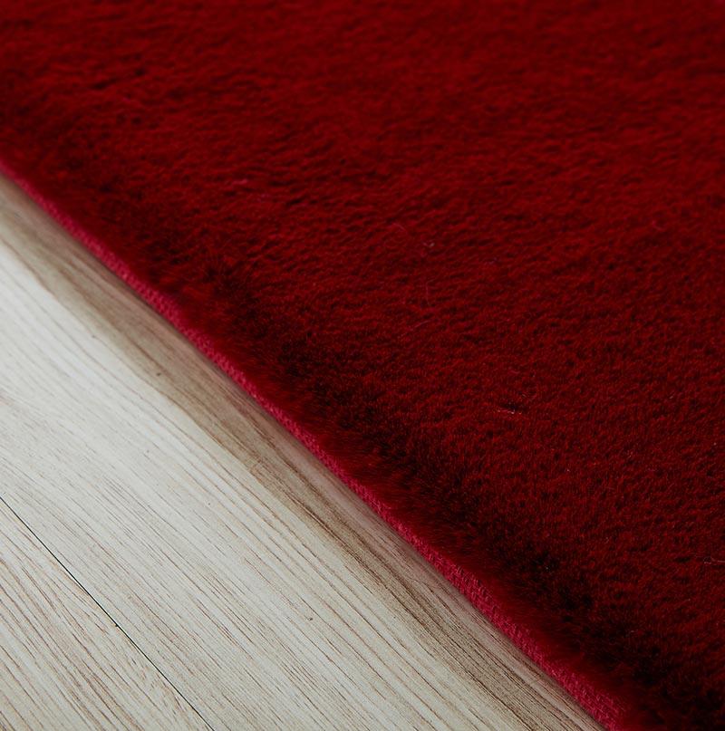 Lily Luxury Red Chinchilla Faux Fur Area Rug showcasing a plush, vibrant red surface with a soft texture, perfect for contemporary living spaces.