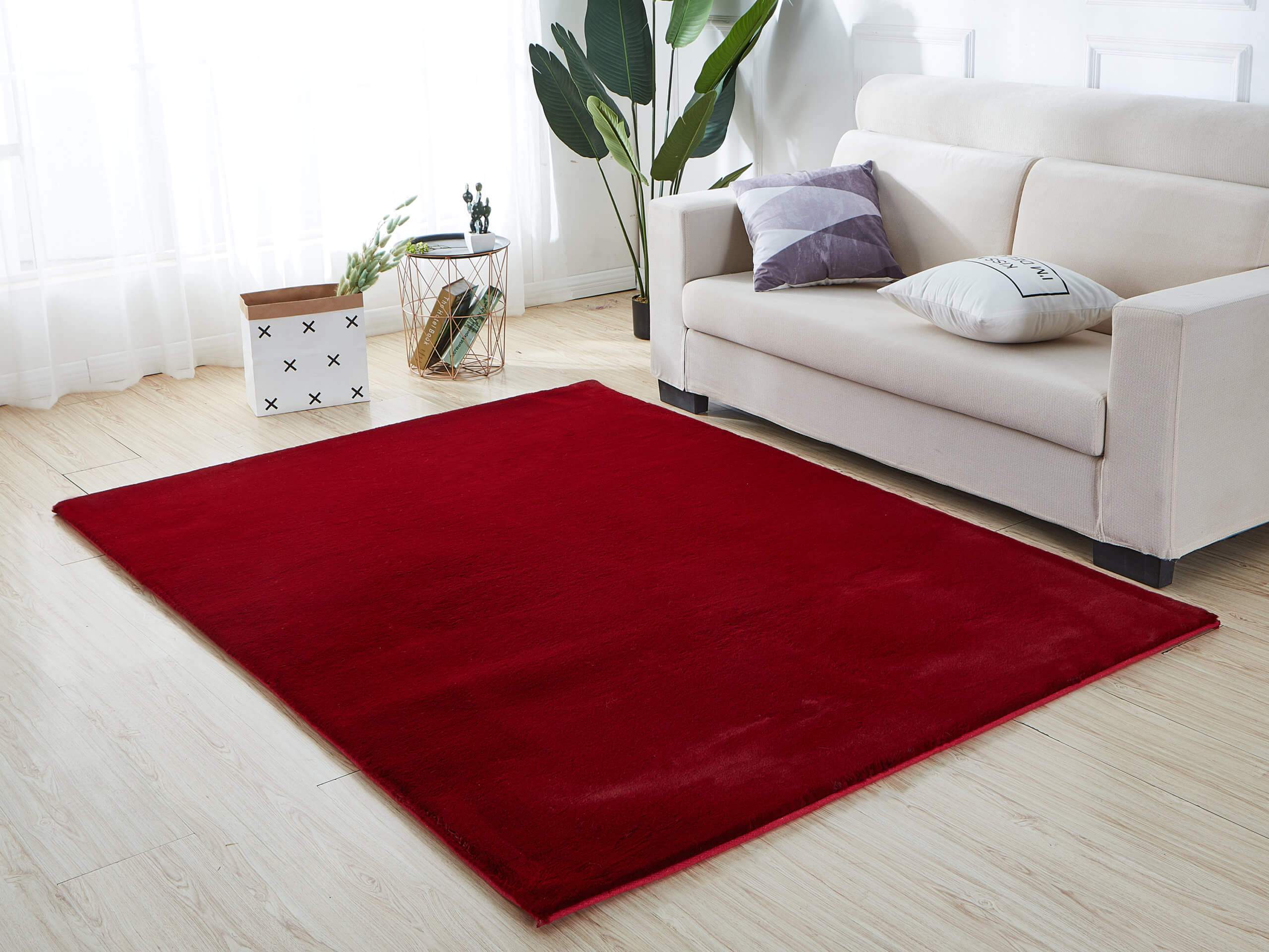 Lily Luxury Red Chinchilla Faux Fur Area Rug showcasing a plush, vibrant red surface with a soft texture, perfect for contemporary living spaces.