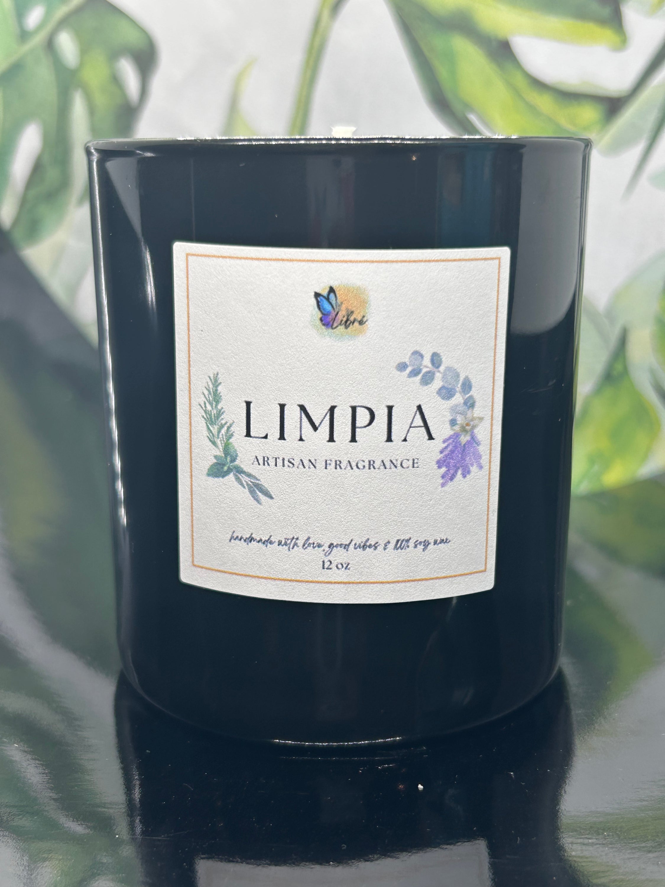 Limpia Artisan Fragrance Candle with sage, lavender, and rose petals, showcasing its elegant design and soothing aroma.