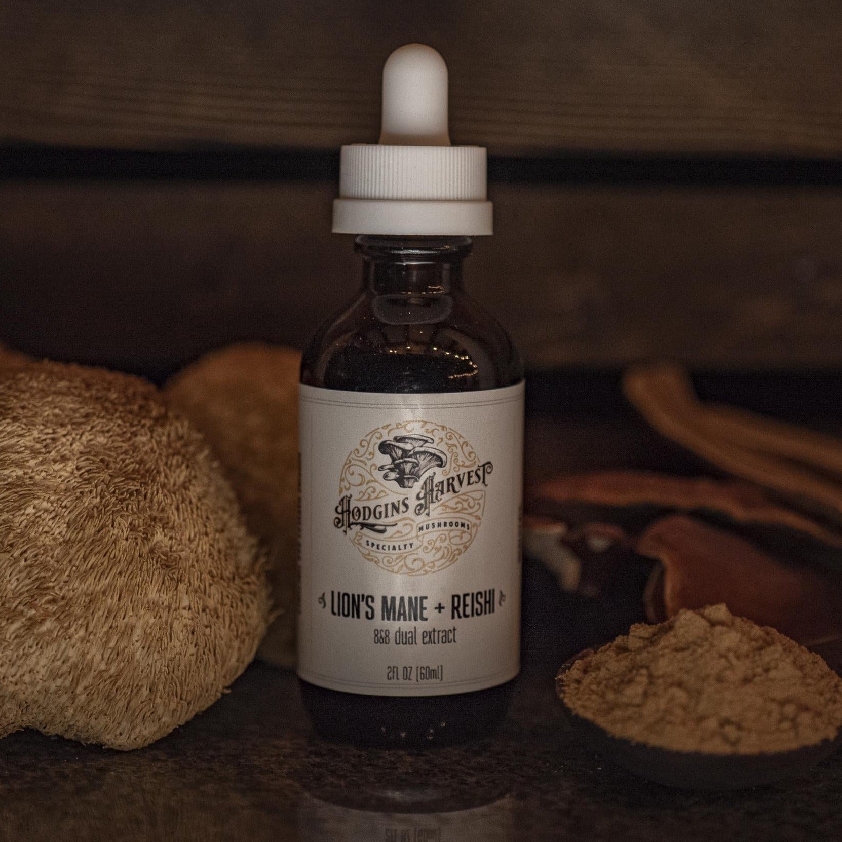 A 4 fl oz bottle of Lion's Mane + Reishi Dual Extract Tincture with a dropper, showcasing its natural ingredients.