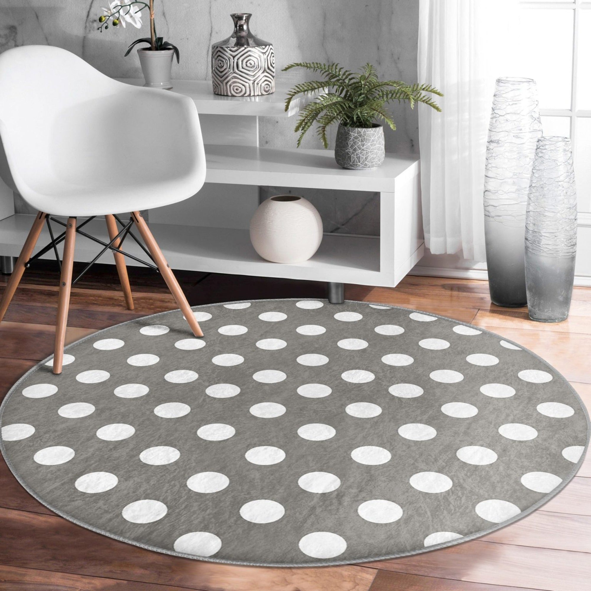 Stylish grey washable rug with soft velvet texture, perfect for living room decor.