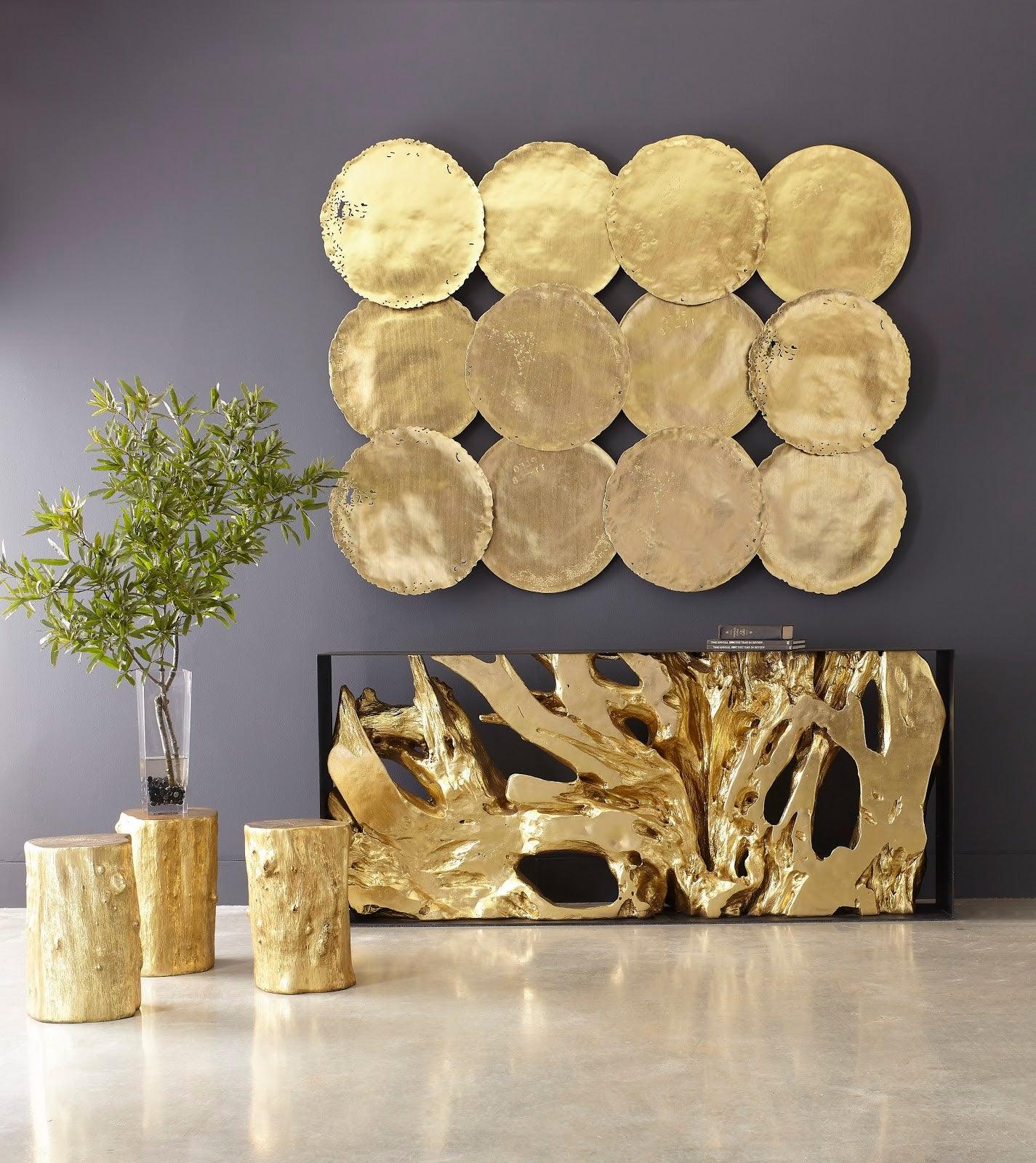 Log Small Gold Stool with a luminous gold leaf finish, resembling a natural log, perfect for modern interiors.