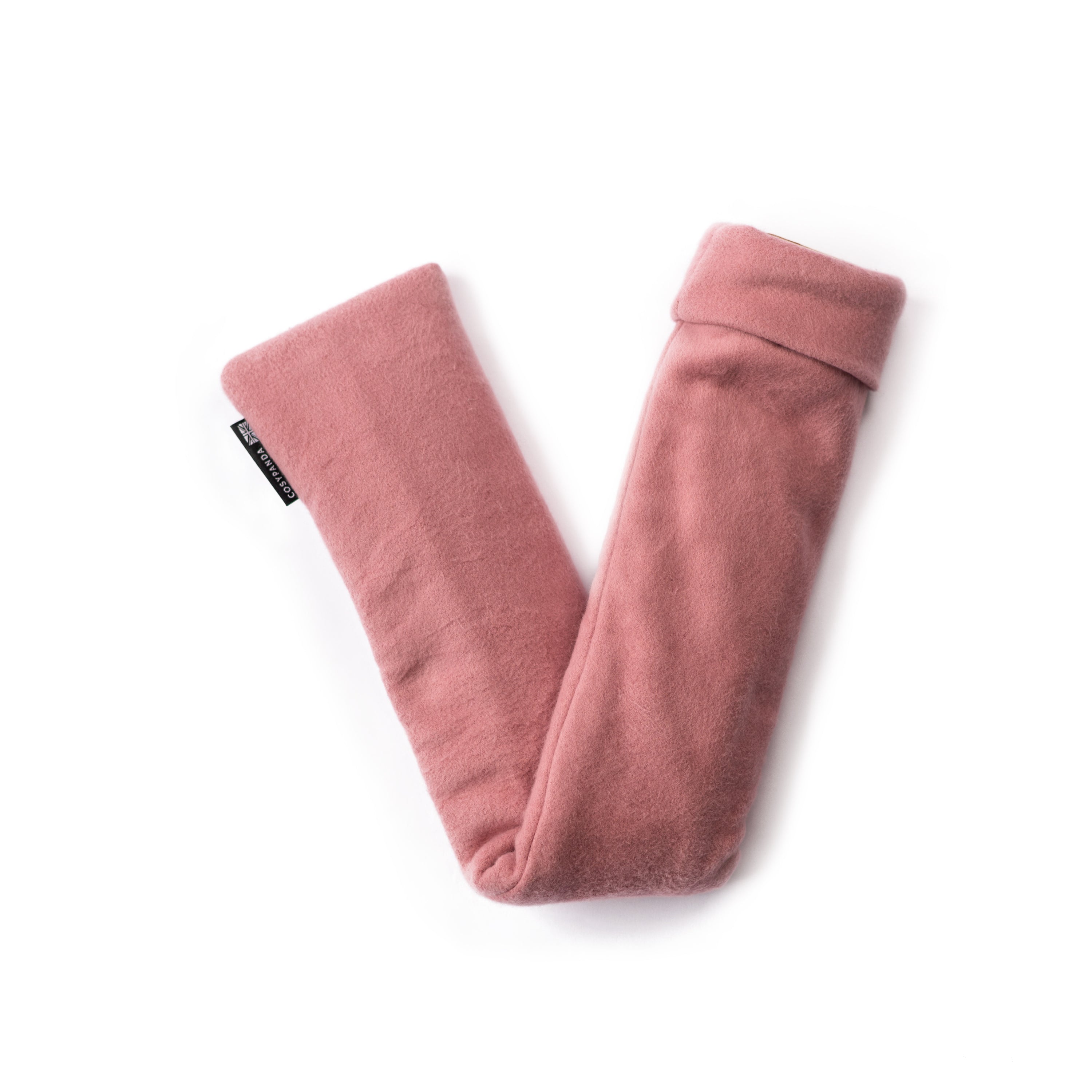 Long Organic Cotton Pink Hot Water Bottle with a soft pink cover, designed for comfort and warmth, ideal for soothing aches.