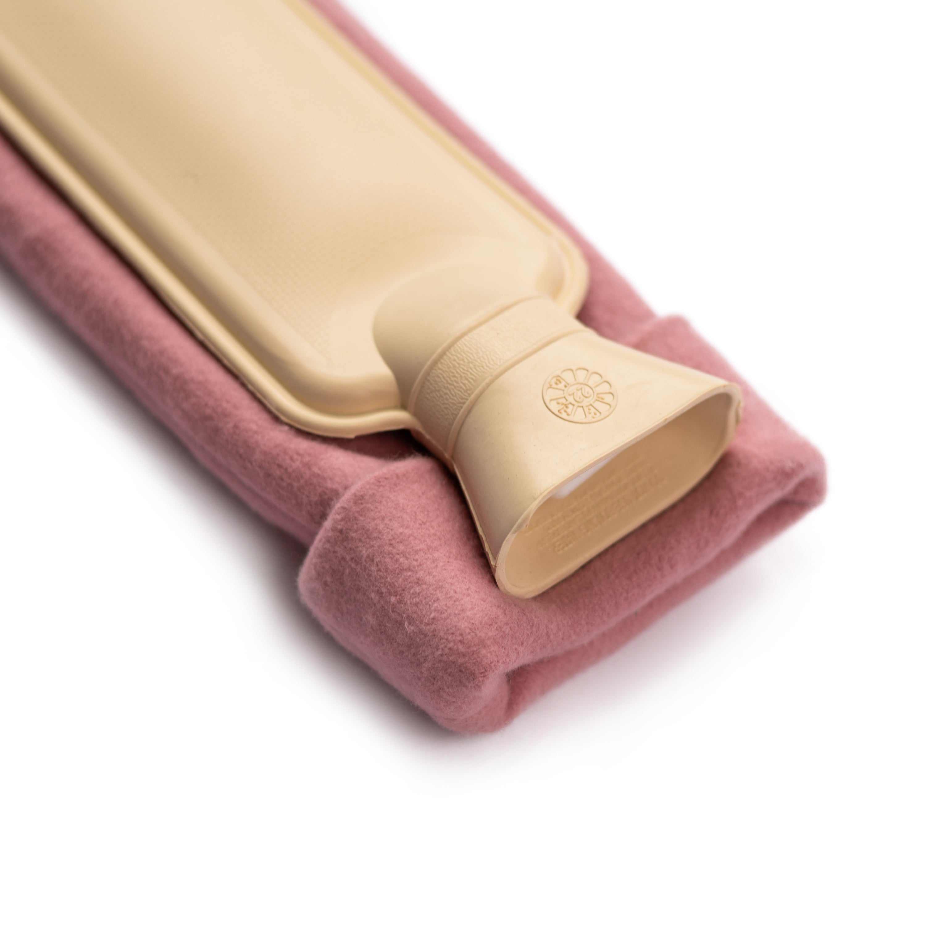 Long Organic Cotton Pink Hot Water Bottle with a soft pink cover, designed for comfort and warmth, ideal for soothing aches.