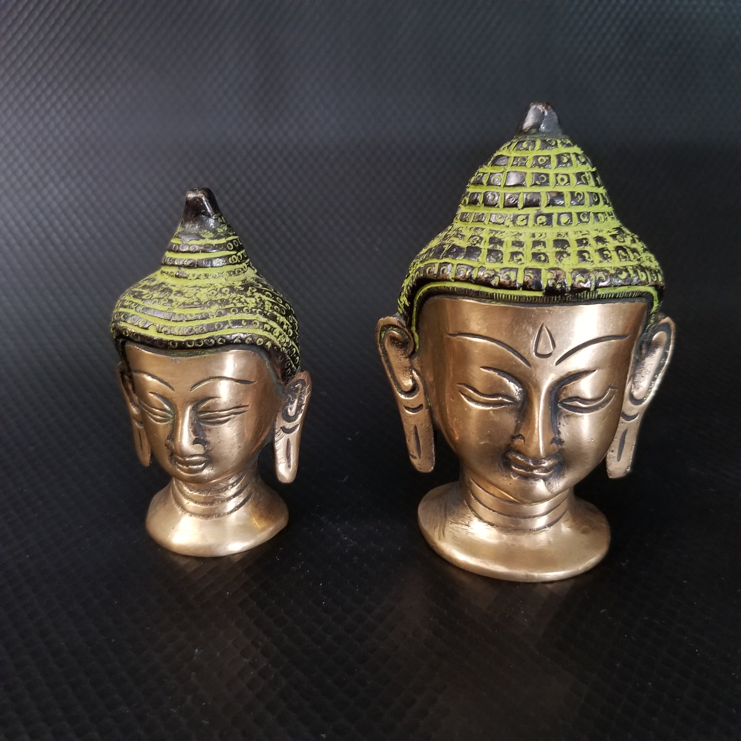 A beautifully handcrafted Lord Buddha Head Brass statue showcasing intricate details, antique green paint, and a vintage patina finish.