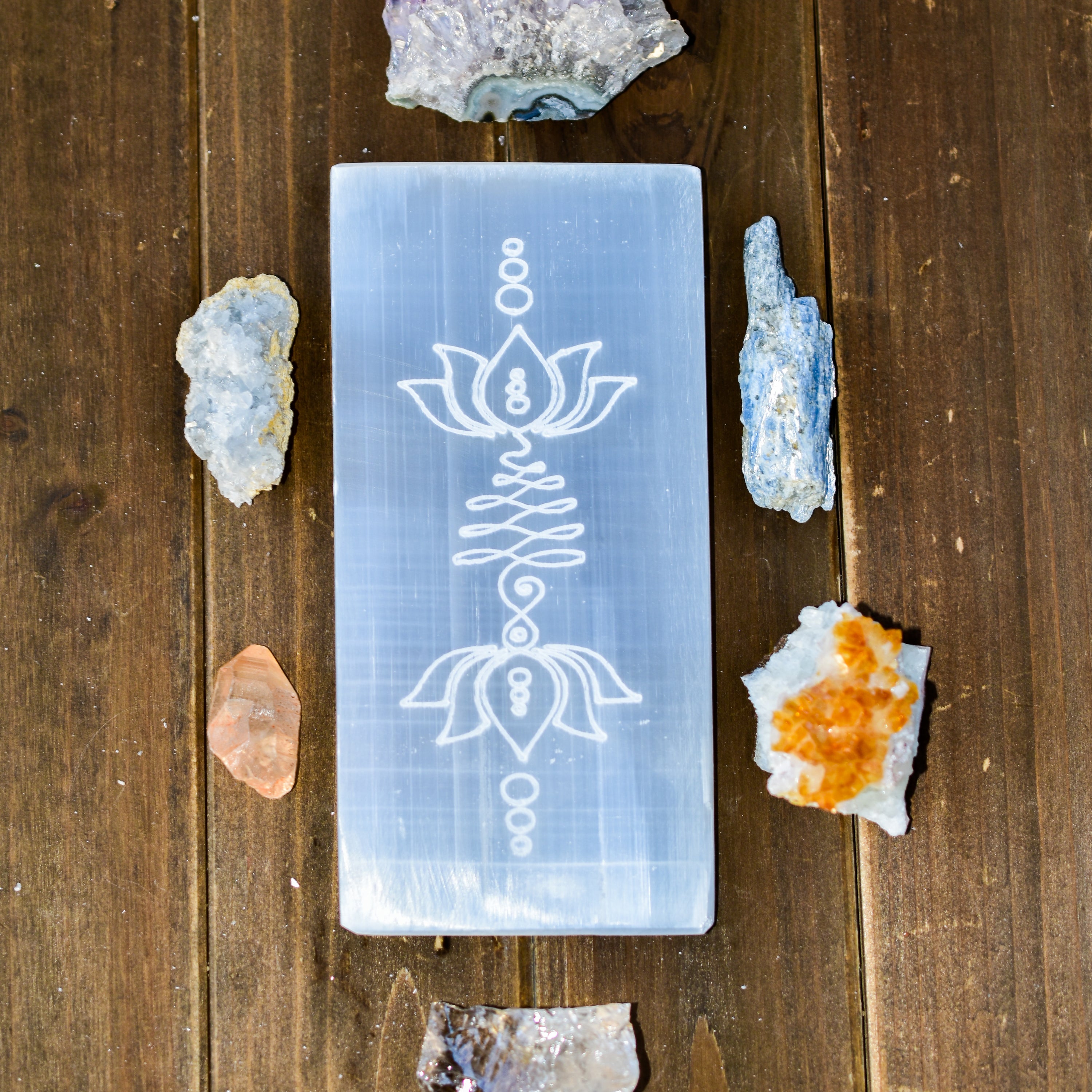 Large rectangular selenite plate engraved with lotus flower and unalome design, perfect for charging crystals.