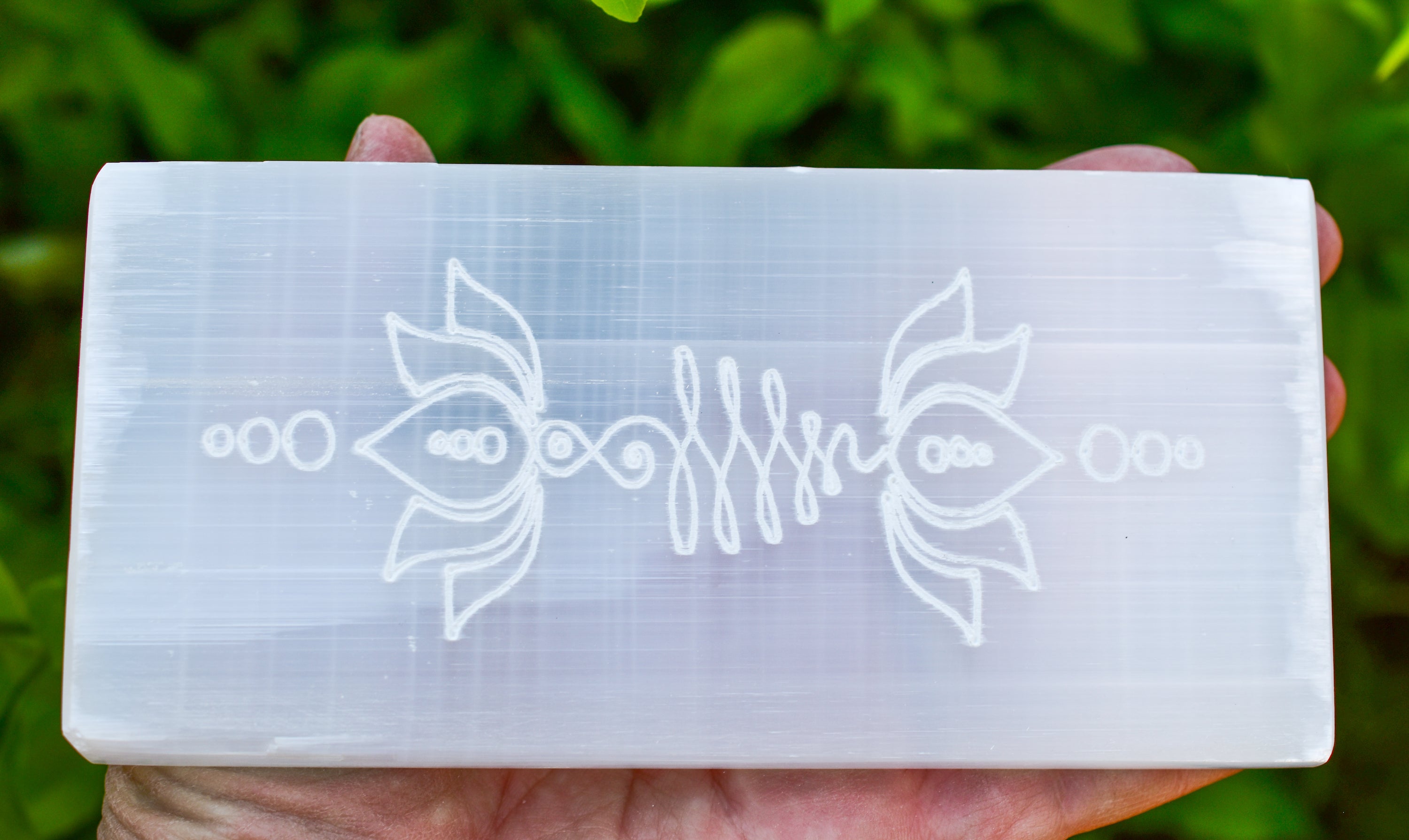 Large rectangular selenite plate engraved with lotus flower and unalome design, perfect for charging crystals.