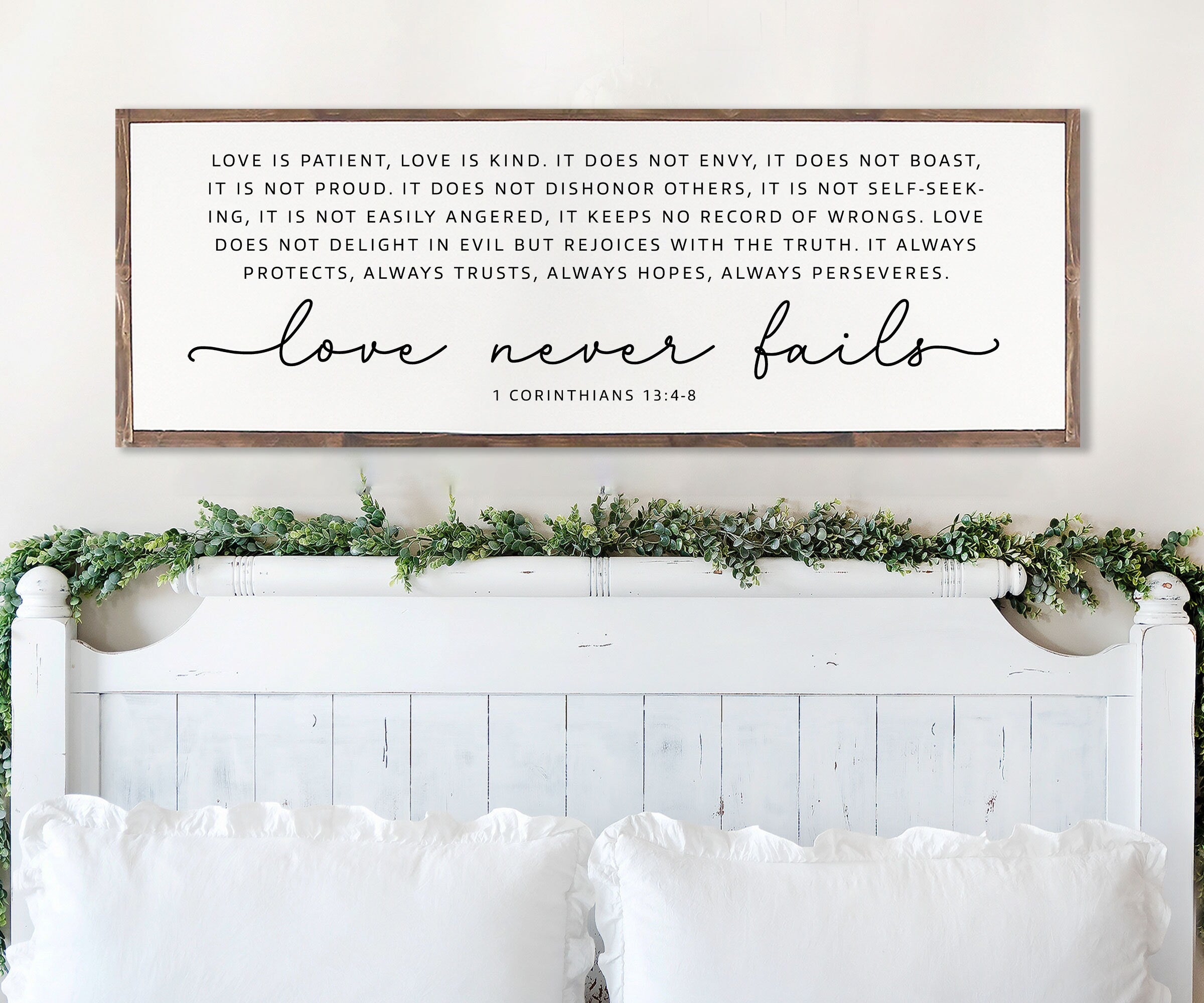 Handmade rustic wood sign featuring the scripture 'Love Never Fails' from 1 Corinthians 13:4-8, framed and customizable in various colors.