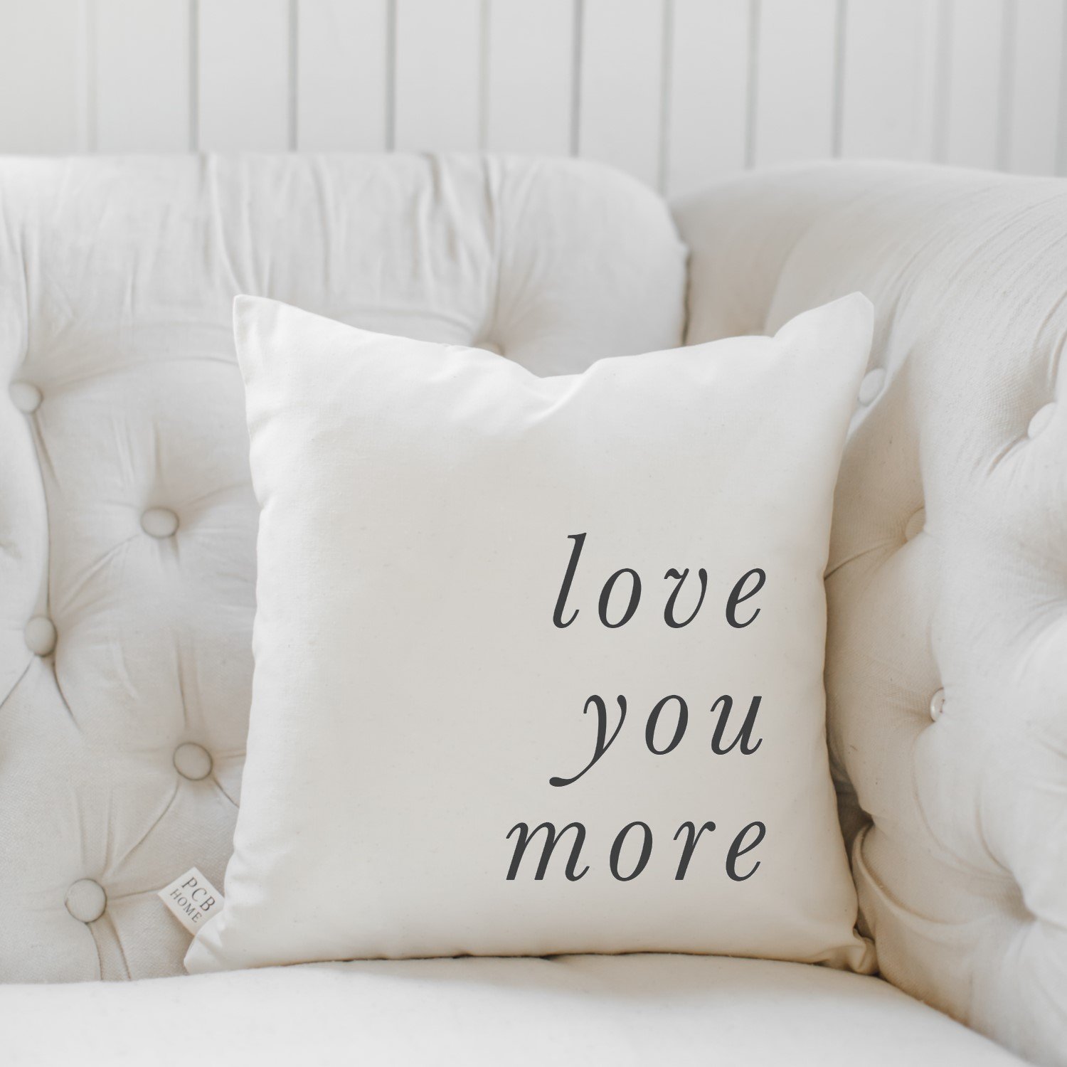 Love You More Type Pillow featuring unique calligraphy design on natural cotton fabric, perfect for cozy home decor.